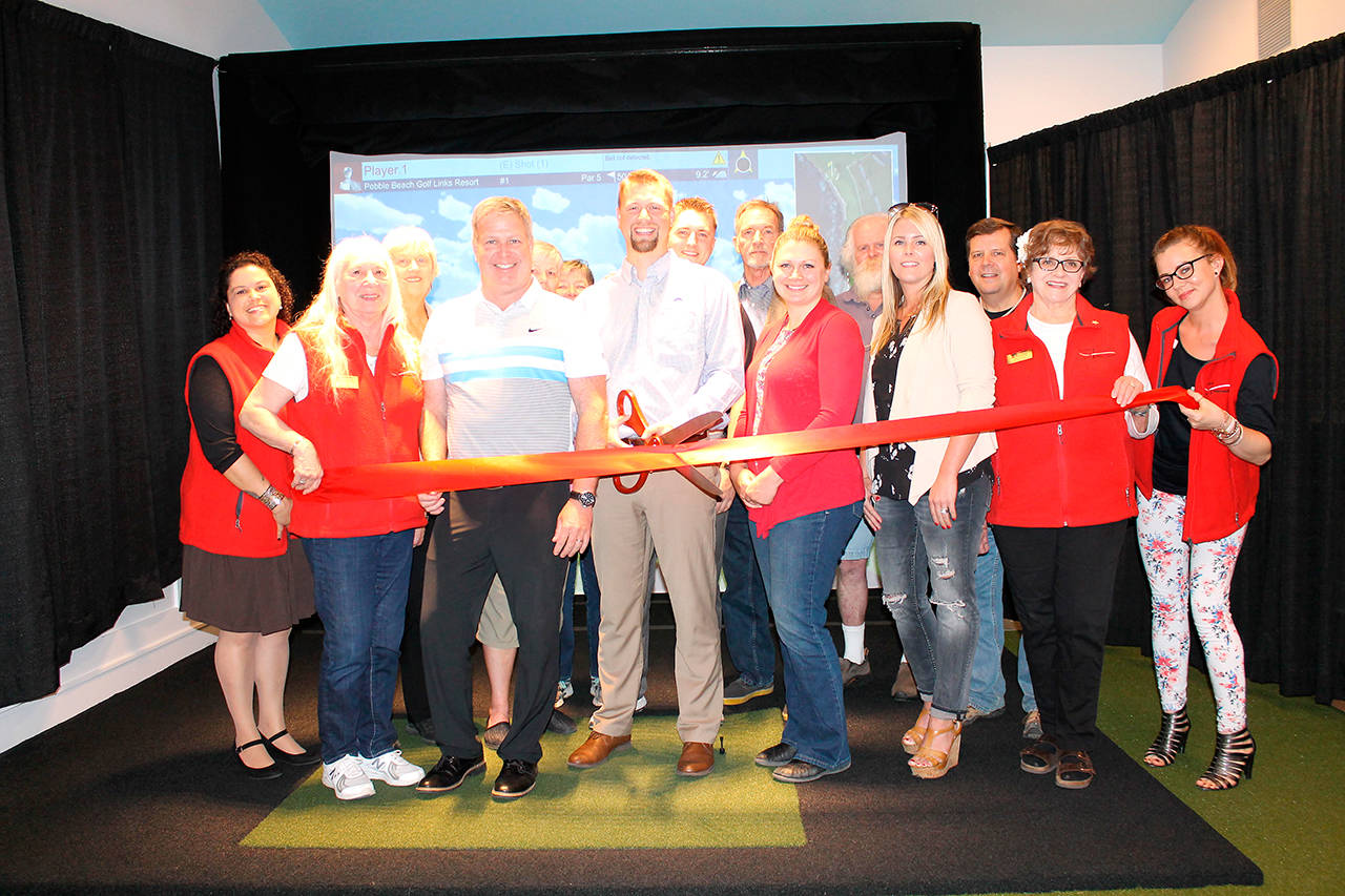 Peninsula Golf Club in Port Angeles recently held a ribbon-cutting ceremony for the course’s brand new golf simulator with the Port Angeles Ambassadors. Peninsula head pro Chad Wagner holds the scissors and is joined by Bill Shea, Cedars at Dungeness Director of Golf, as well as club members Ruth Thomson, Sue Barber, Dorris Sparks, assistant pro Jake Lotzgesell, Marc Jackson and Al Osterberg.