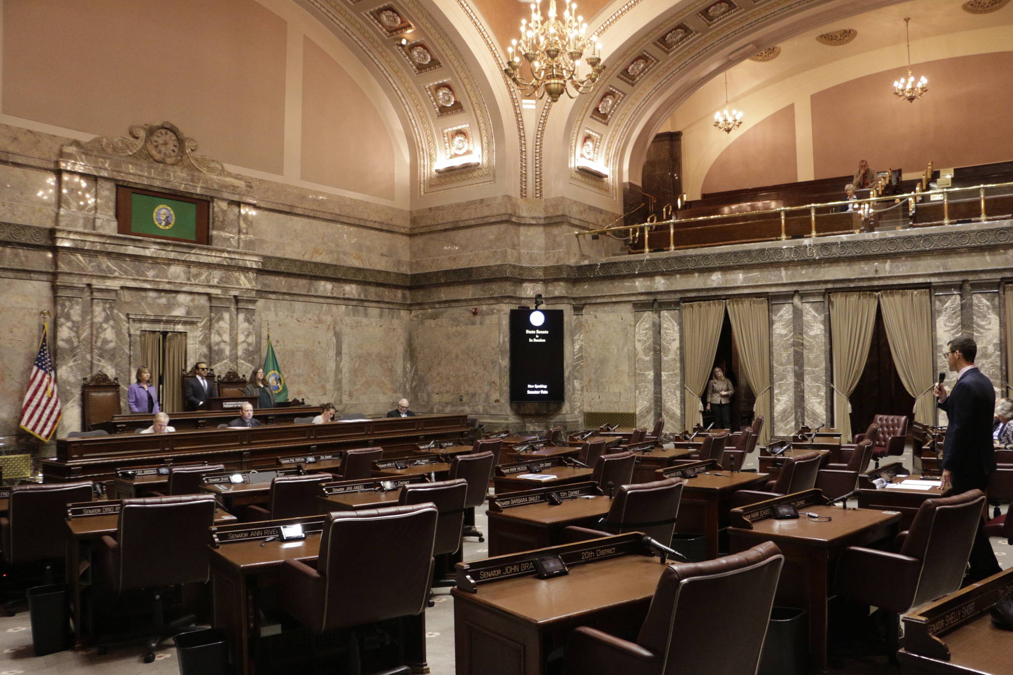 Republican Sen. Joe Fain, far right, speaks in a mostly empty Senate chamber during adjournment of a 30-day special legislative session Tuesday in Olympia. (Rachel La Corte/The Associated Press)