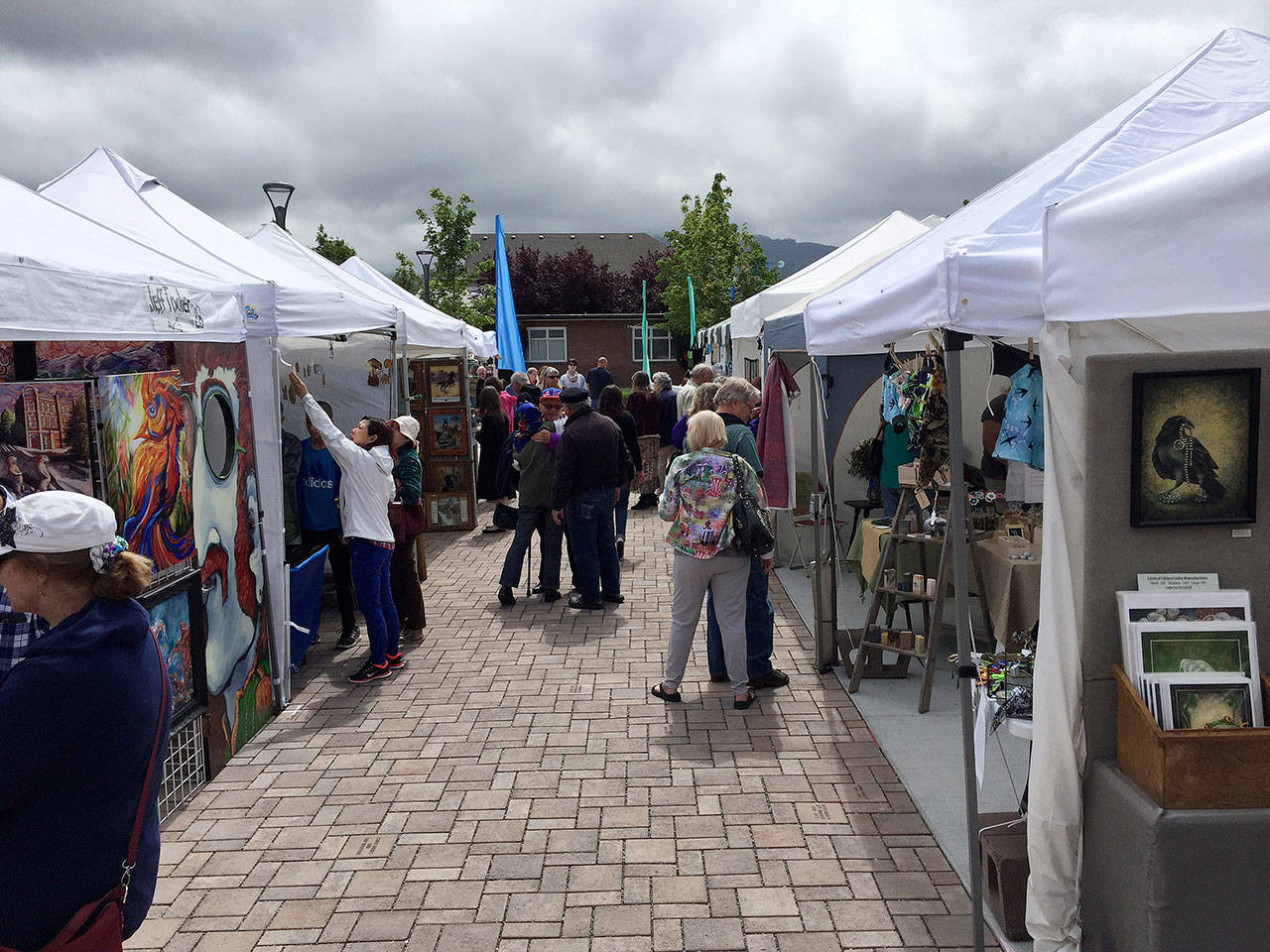 Visitors check out booths at the Innovative Arts and Crafts Fair during a past Sequim Irrigation Festival.