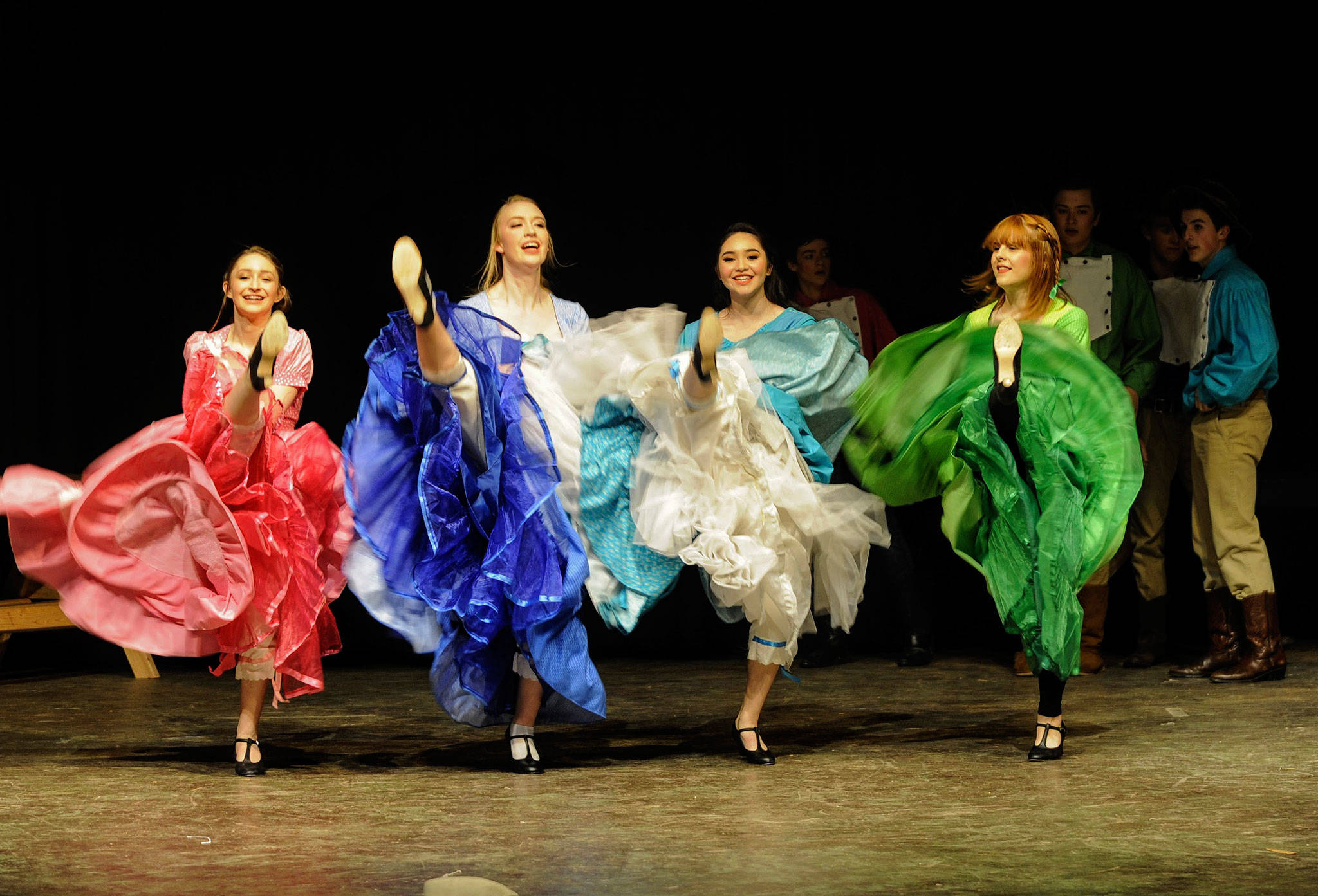 Sisters Makenna O’Dell, Abby Norman, Erin Gordon and Alison Cobb, from left, kick up their heels for the “Challenge Dance.” (Matthew Nash/Olympic Peninsula News Group)