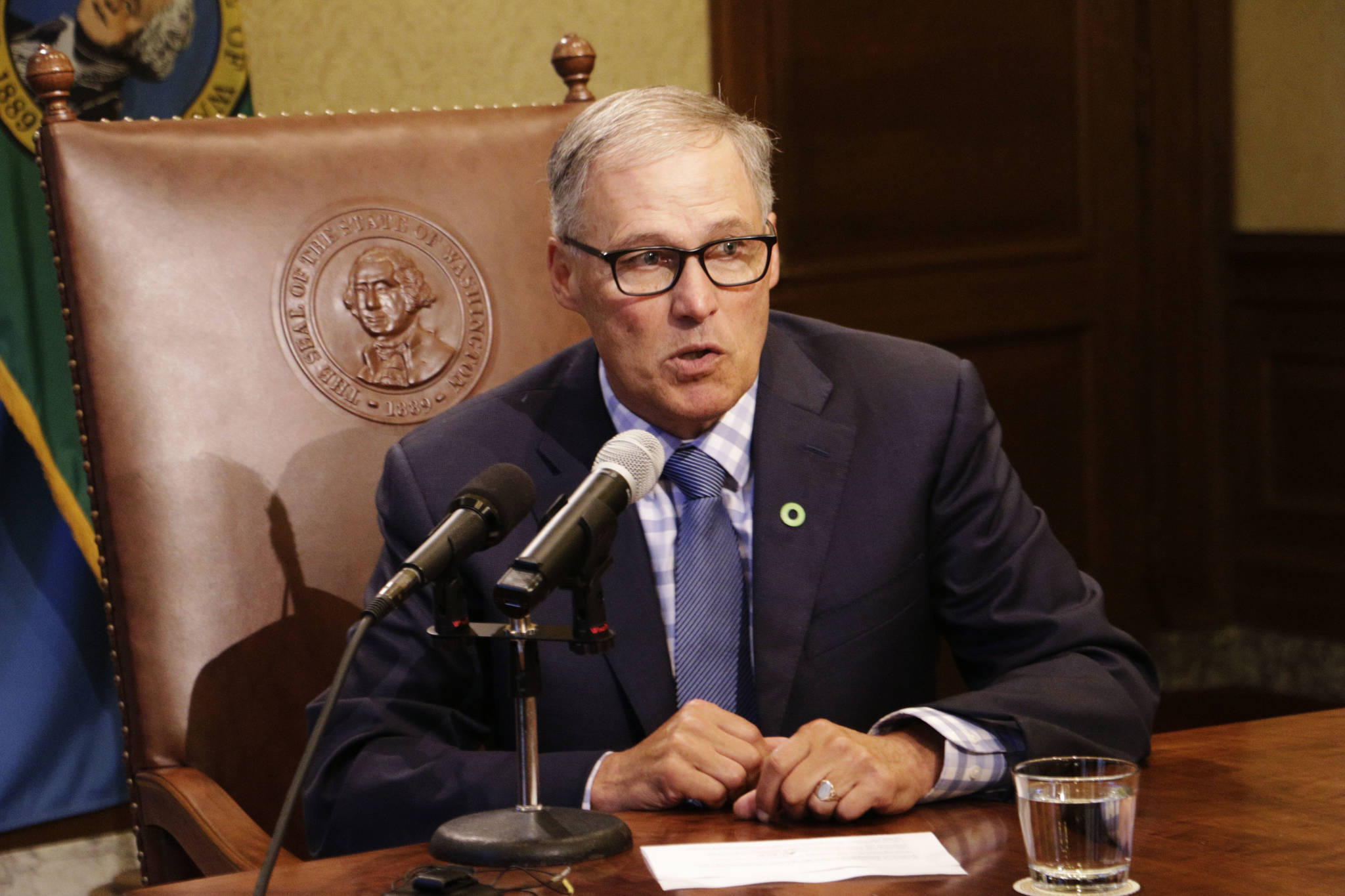 Gov. Jay Inslee talks to reporters about ongoing budget negotiations Tuesday in Olympia. (Rachel La Corte/The Associated Press)