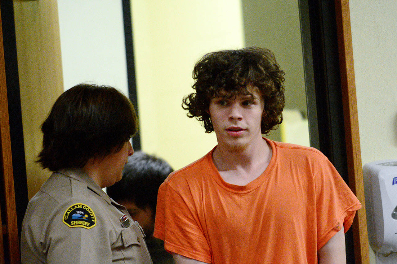 Joseph Warren Recoy, 24, is escorted into Clallam County Superior Court on Tuesday. (Jesse Major/Peninsula Daily News)