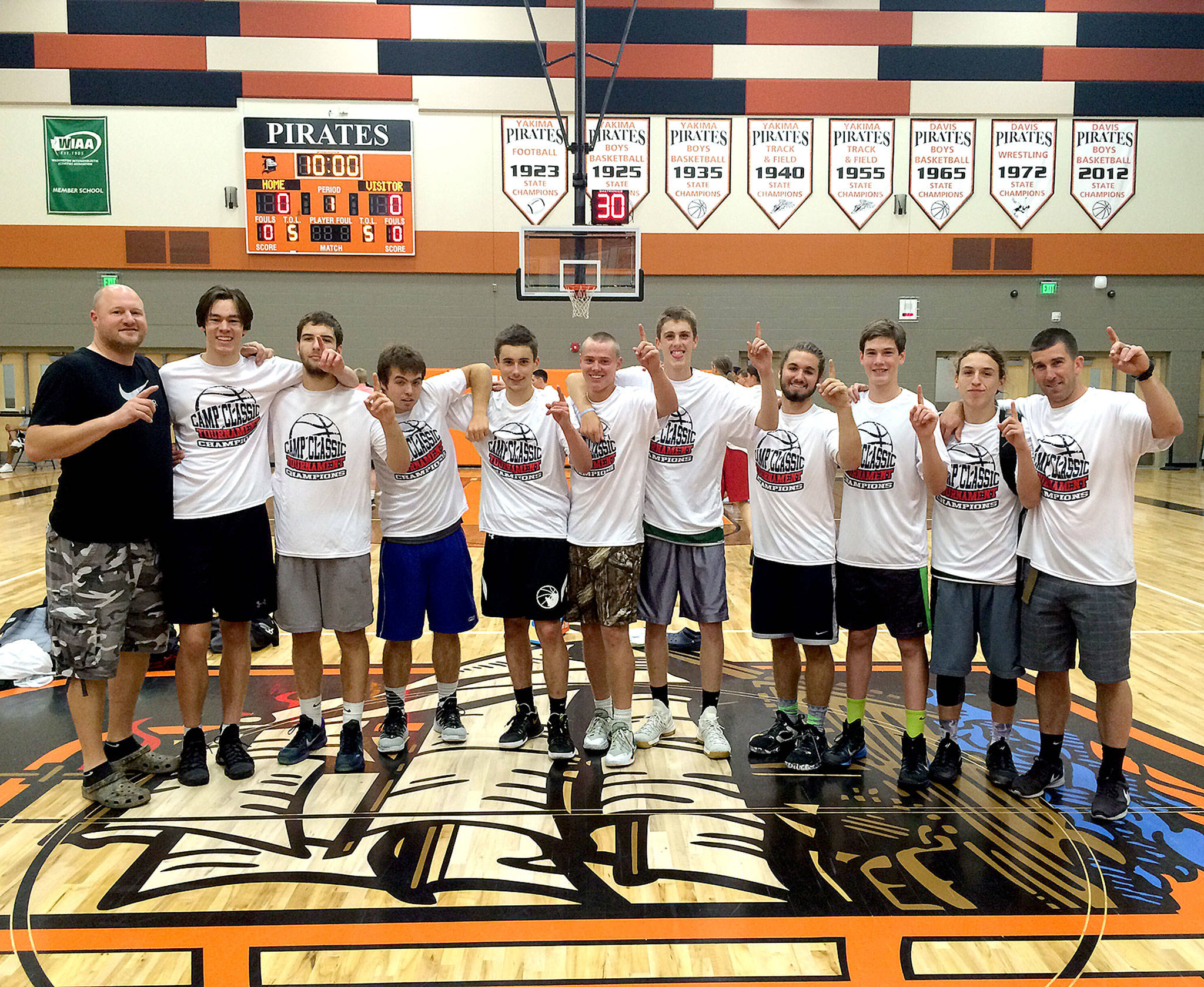 The Port Angeles High School summer team had a successful tournament at the Camp Classic in Yakima, beating out 29 other schools to win the title. Port Angeles went 9-3 in the three-day tournament and beat Ephrata 70-40 in the semifinals and Wapato 65-61 in the championship game. The junior varsity team went undefeated in pool play, but lost 55-51 to Grandview in the title game. From left are coach Danny Linde, Liam Clark , Garrett Edwards , Andrew Borde, Kyle Benedict, Easton Joslin, Payton Schmidt, Carson Shamp, Gabe Long, Gary Johnson and coach Kasey Ulin.