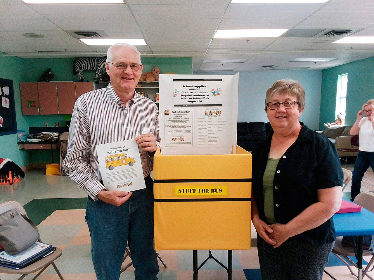 Ted and Philomena Lund display a school supplies drop-off box featured at several locations across Sequim in coming weeks.