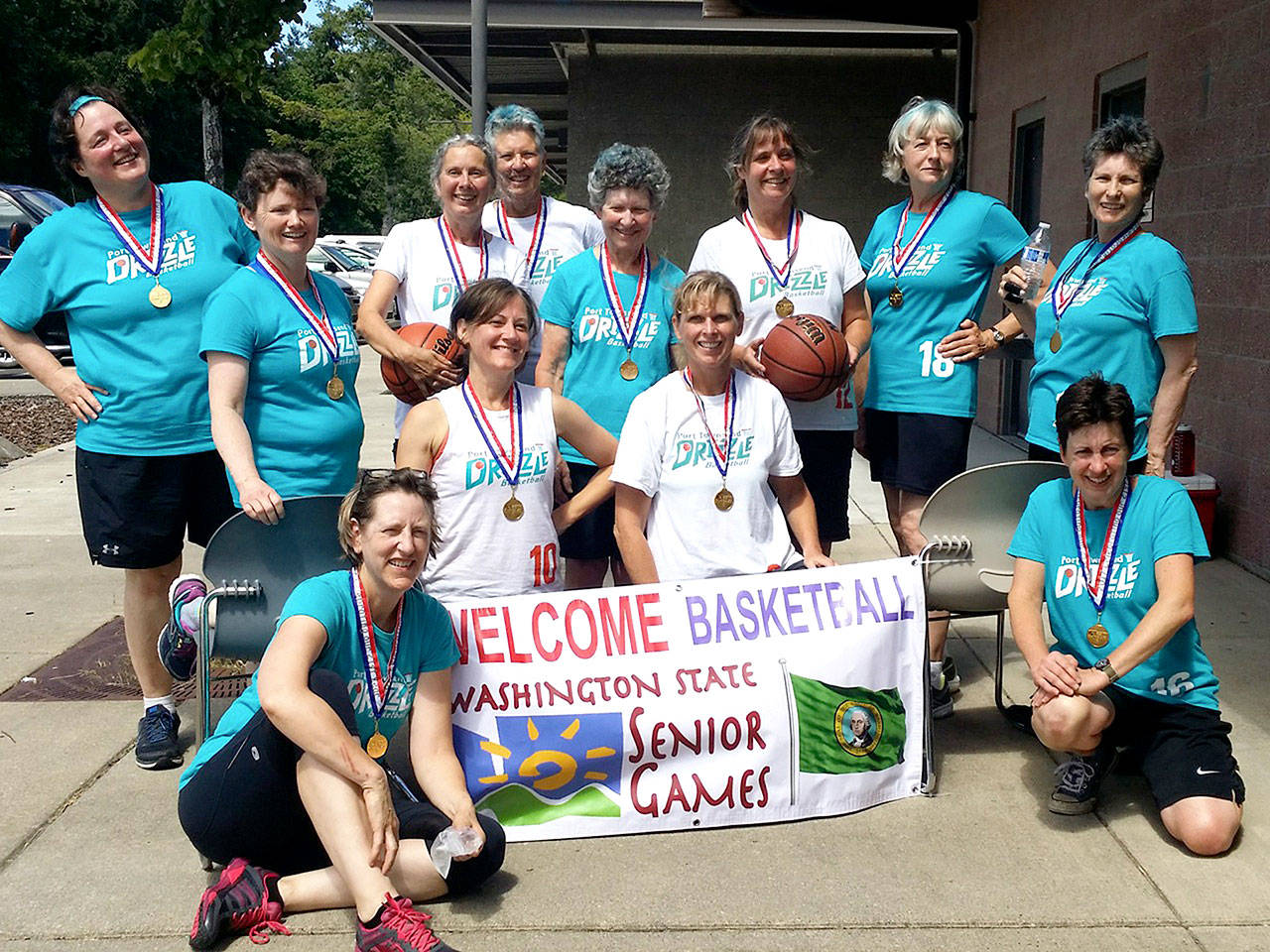 The Port Townsend Drizzle Women’s Basketball Team brought home the gold from the Washington State Senior Games in Olympia on July 22. This was the third year in a row they won the Women’s 3x3 basketball competition. Gold, silver and bronze medals were also won for the the individual events, hot shot and free throw. From left, front row, are Anna Bachmann, Joanna Sanders, Kristi Wilson and Lisa Anderson. From left, back row, are Robin Stemen, Maria K. Joyce, Sue Lemay, Mary Ann Watson, Diane Bommer, Teresa Janssen, Bev Hetrick and Jean Walat.