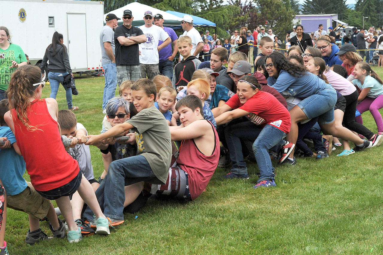 Kids take part in a tug of war at the Forks Old Fashioned Fourth of July celebration on Sunday in Tillicum Park. (Lonnie Archibald/for Peninsula Daily News)