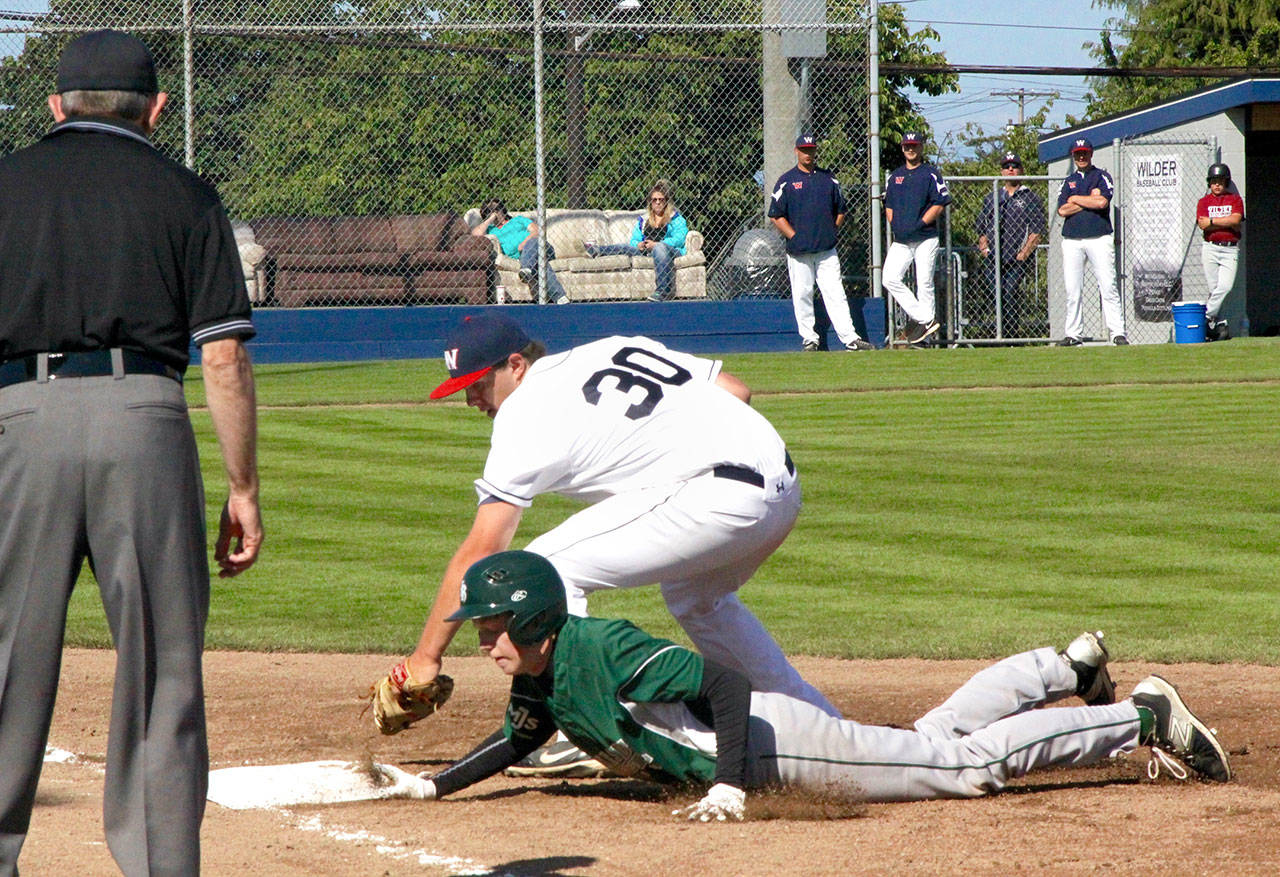 Dave Logan/for Peninsula Daily News                                Wilder’s Kole Milyard (30) tries to pick off Christian Gainer of Lakeside Recovery. Gainer was able to get in safely under the tag.