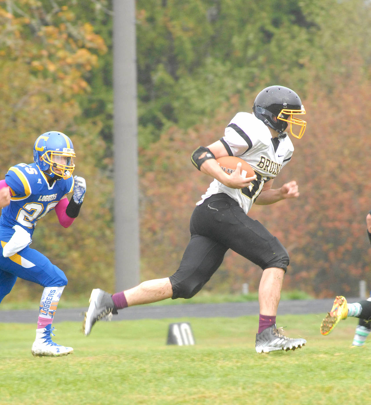 Clallam Bay’s Ryan McCoy, right, runs with the ball during a game against Crescent in 2016. McCoy will play running back and middle linebacker for the Bruins this season.                                Keith Thorpe/Peninsula Daily News