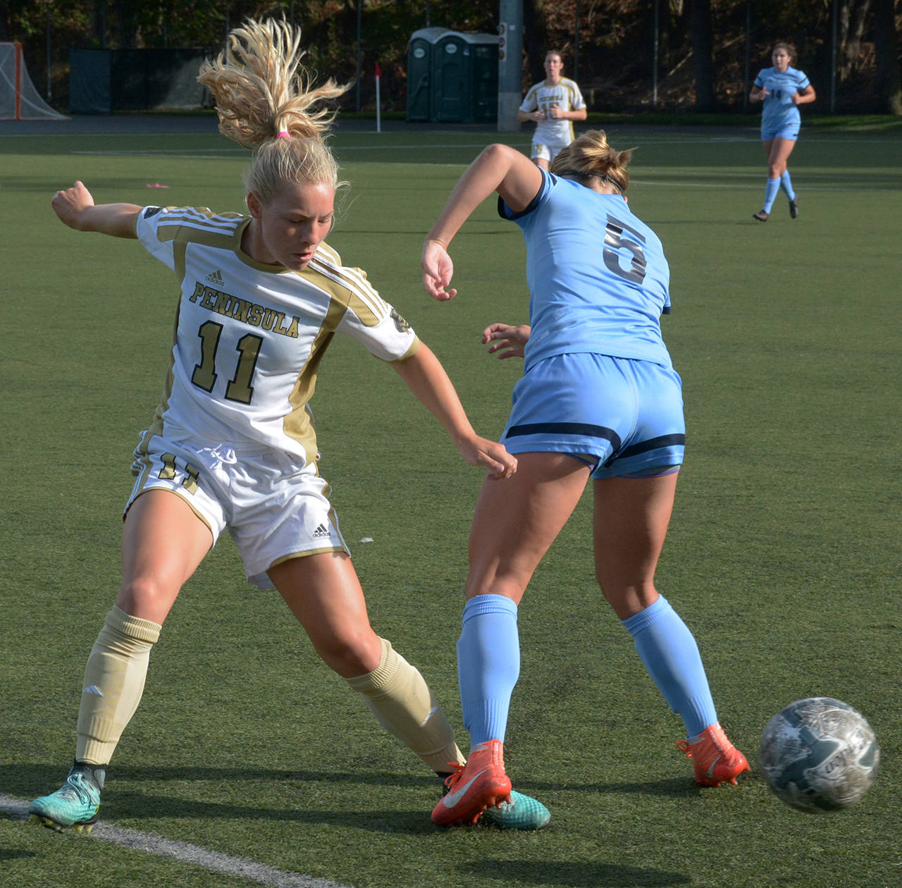 Peninsula’s Maddie Parton (11) vies for control of the ball with a Spokane player during the Pirates’ 4-3 win over the Sasquatch at the NWAC Friendlies in Tukwila on Friday.                                Rick Ross/Peninsula College Athletics