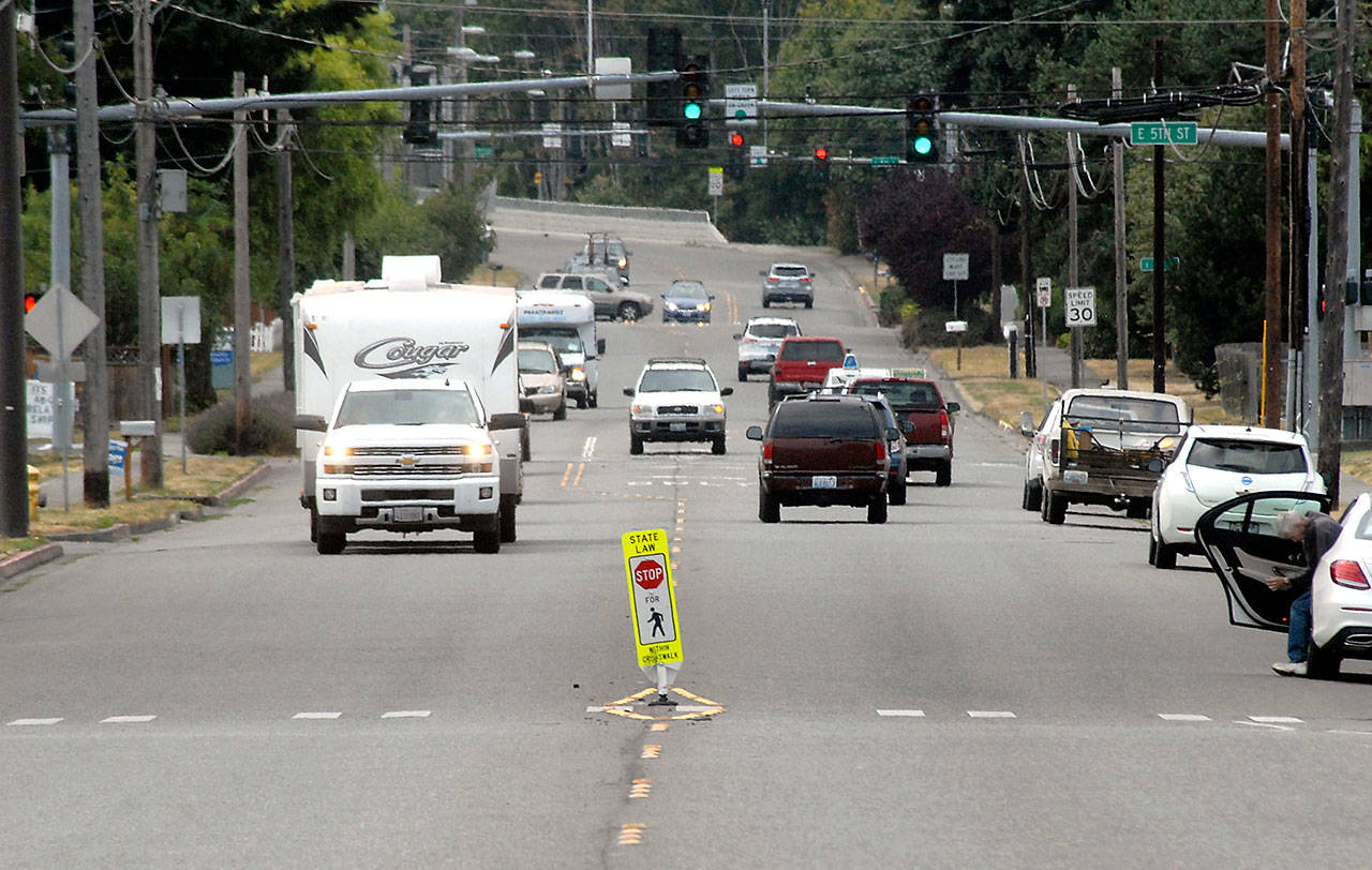 Traffic makes its way along South Race Street in Port Angeles on Thursday. City officials are examining plans to improve the busy corridor while making it friendlier to pedestrians and cyclists. (Keith Thorpe/Peninsula Daily News)