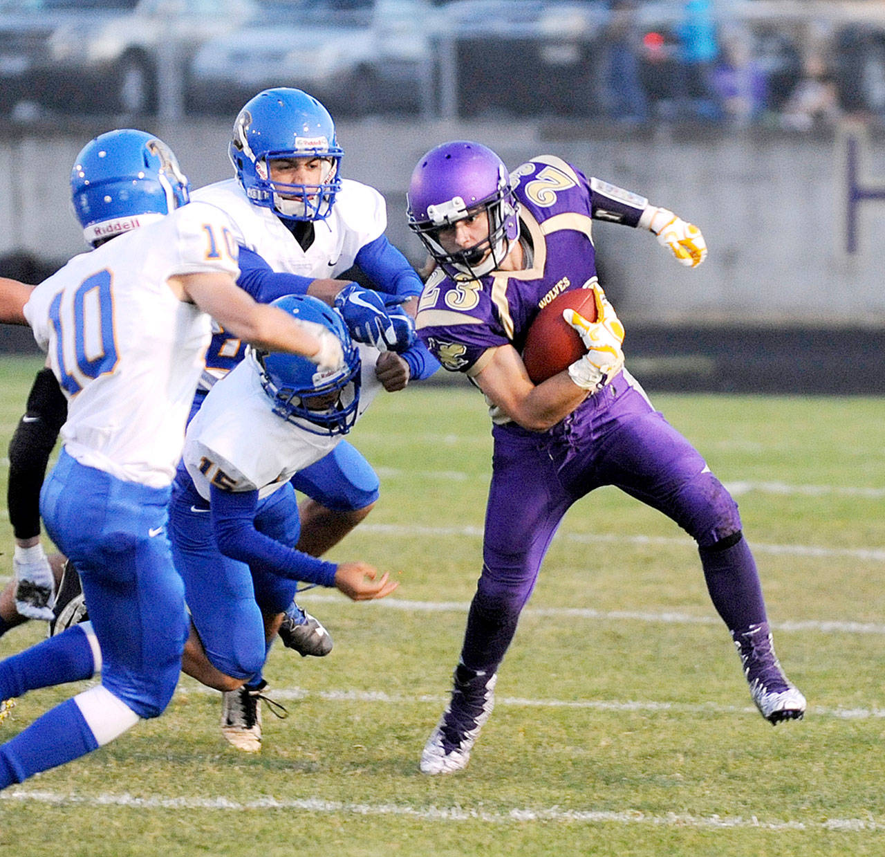 Sequim’s Gavin Velarde (23) slips a tackle en route to a first down Friday night. The visiting Knights reeled off 20 second-half points to knock off Sequim 30-22.Velarde had two touchdowns in the loss. (Michael Dashiell/Olympic Peninsula News Group)