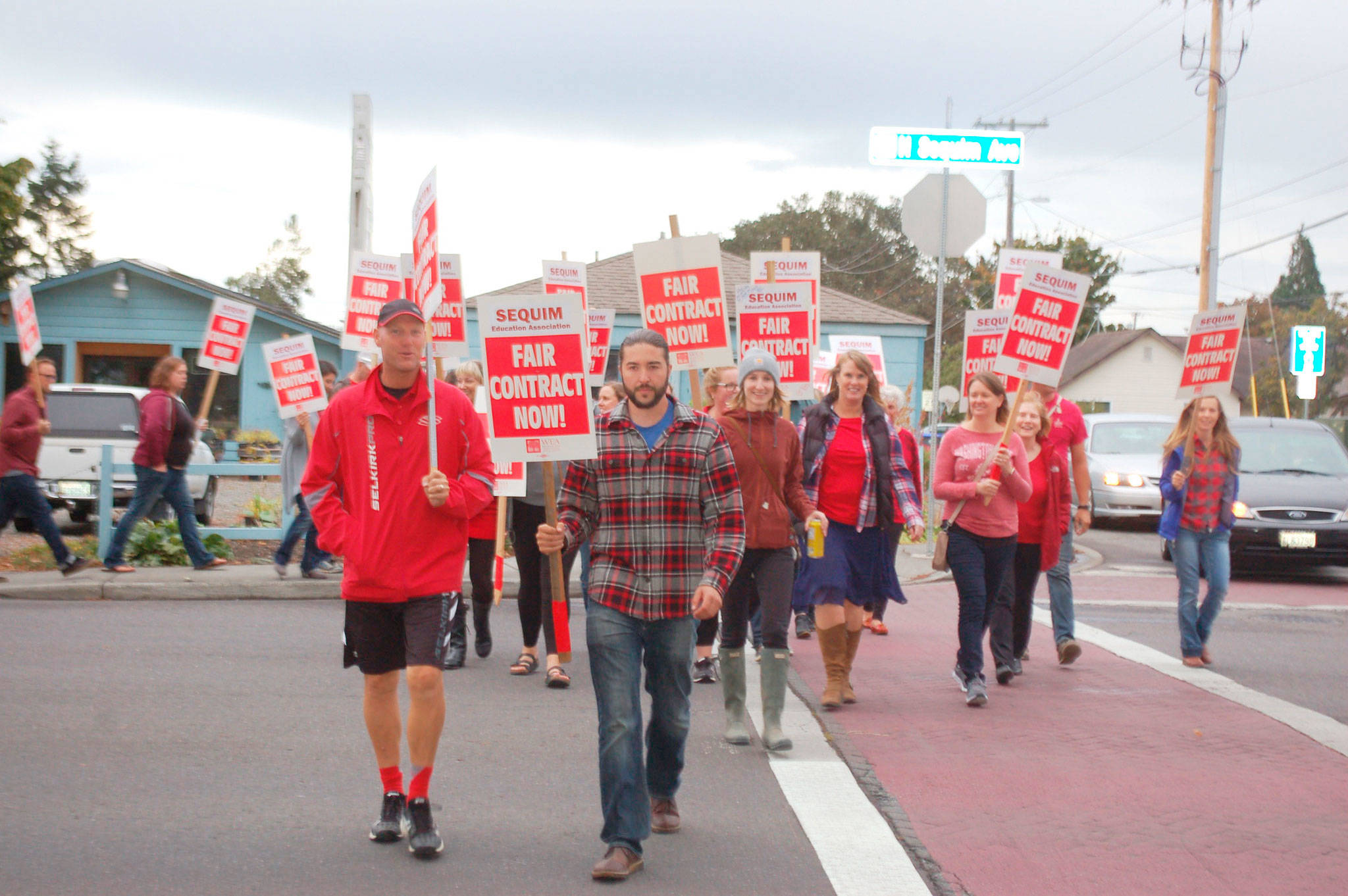 Sequim School District teachers and supporters lobby outside the Sequim High School auditorium and along North Sequim Avenue before a school board meeting Sept. 18. Teachers will hold off on a proposed strike after the teachers union came to a tentative agreement with the district regarding teacher contracts Monday. (Erin Hawkins/Olympic Peninsula News Group)