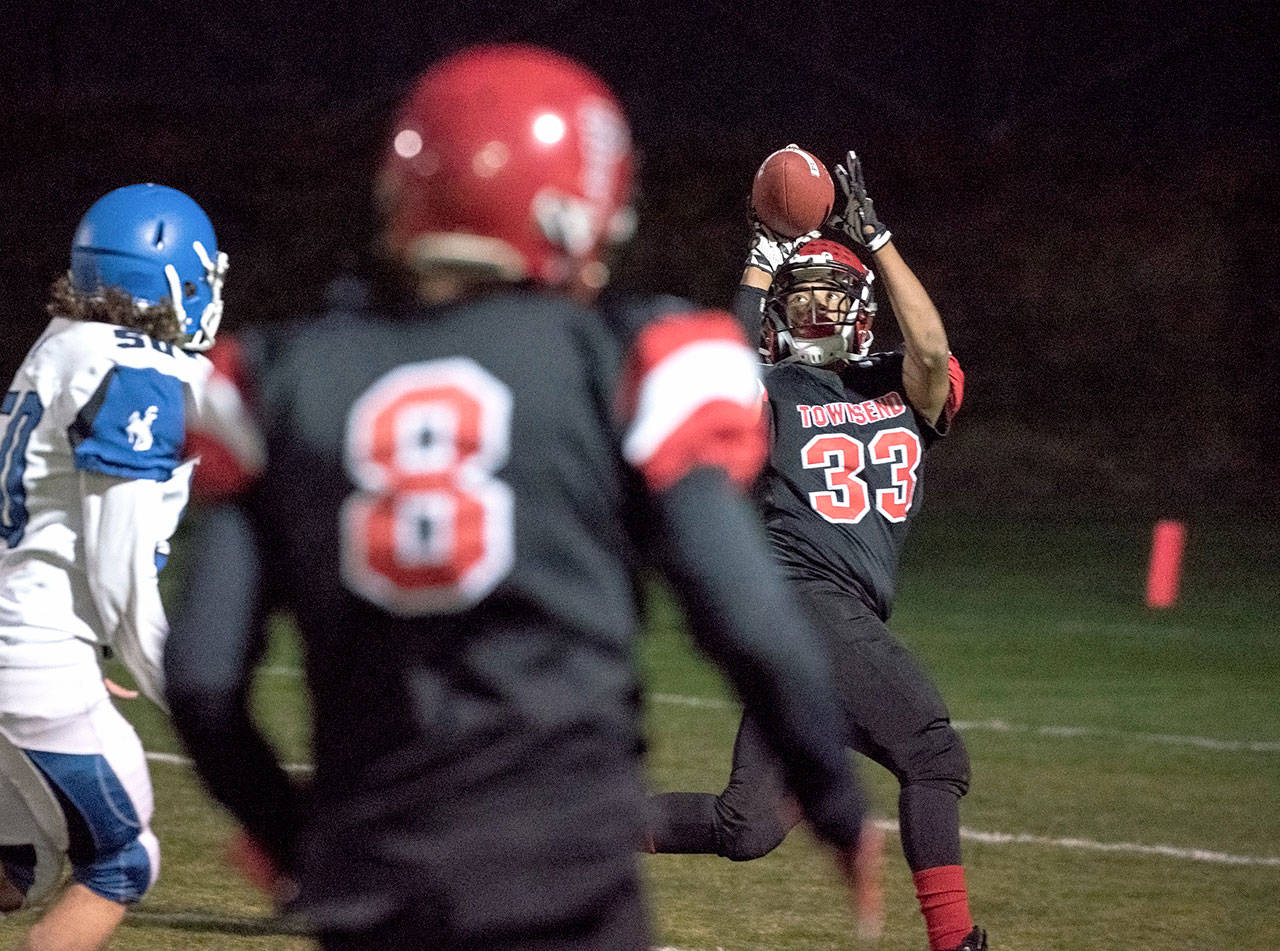 Steve Mullensky/for Peninsula Daily News                                Port Townsends Jacob Boucher pulls in a 39-yard pass to set up a touchdown on the next play against the Chimacum Cowboys.