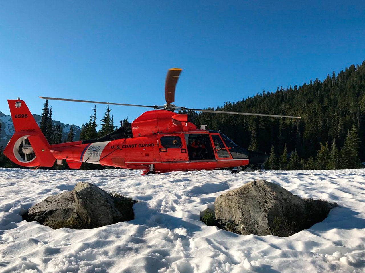 A U.S. Coast Guard crew from Air Station Port Angeles airlifted a 77-year-old hiker out of Olympic National Forest on Monday. (U.S. Coast Guard)