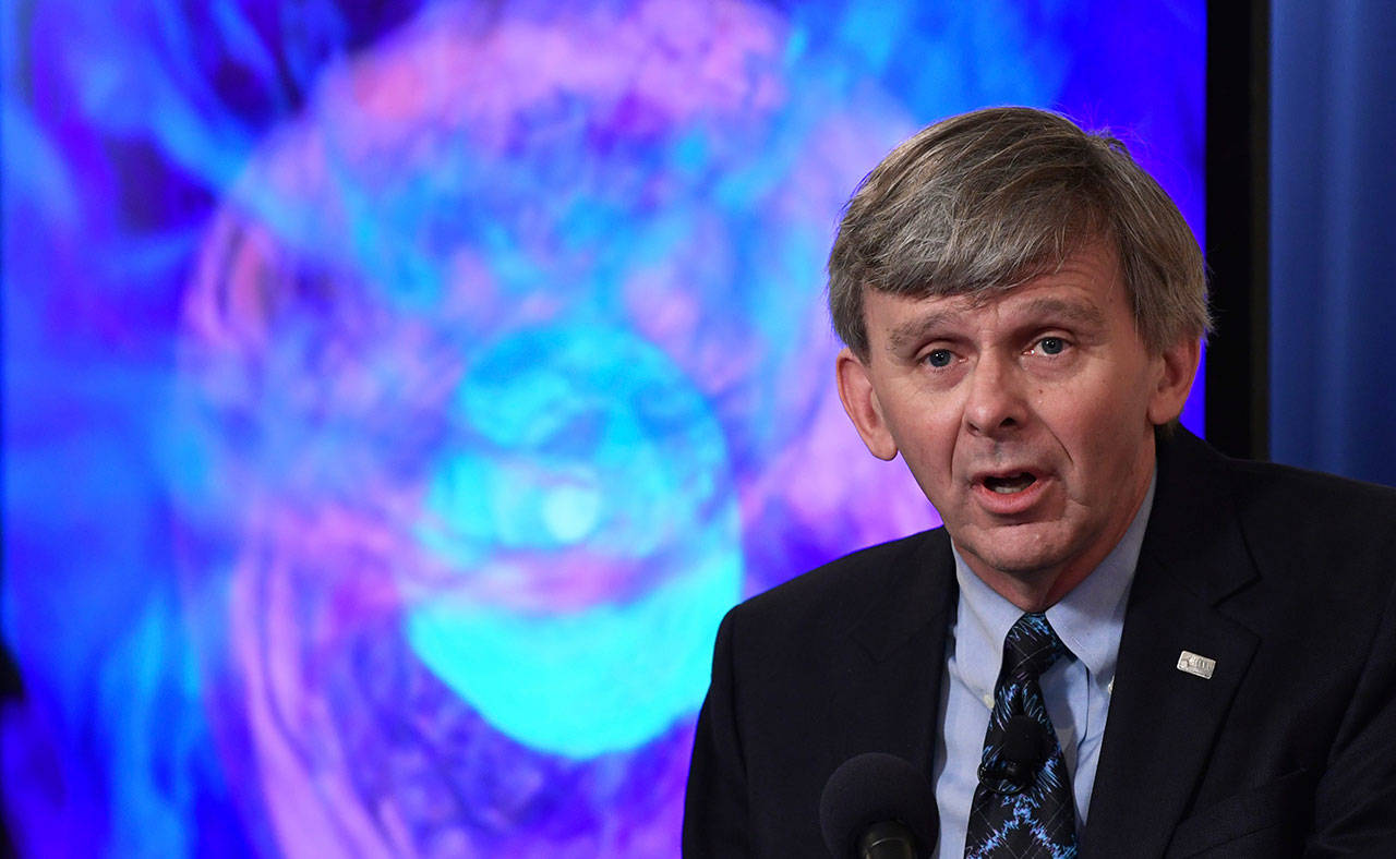 David Reitze of the California Institute of Technology and the executive director of the Laser Interferometer Gravitational-Wave Observatory, or LIGO, speaks at the National Press Club in Washington, D.C., on Monday during an announcement on one of the most violent events in the cosmos that was witnessed completely for the first time in August and tells scientists where gold and other heavy elements come from. (Susan Walsh/The Associated Press)