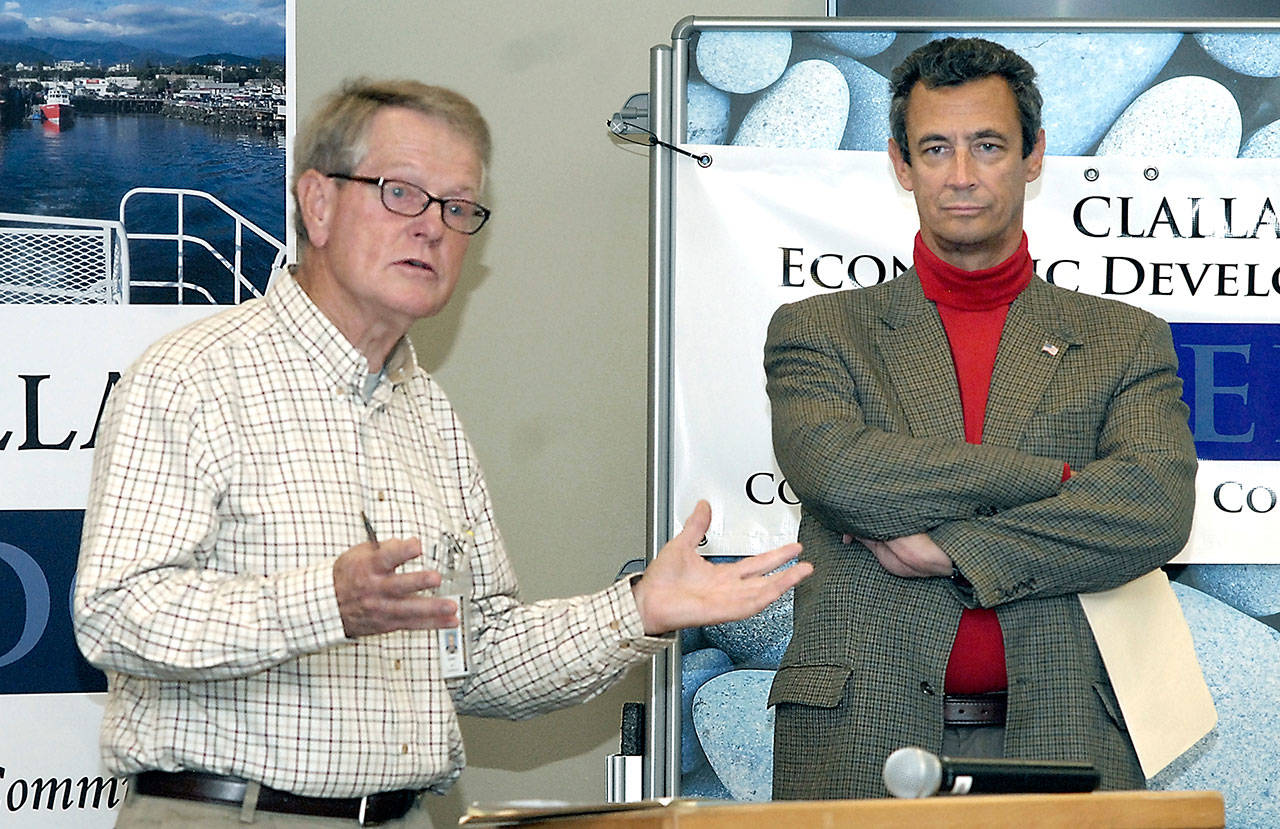 Clallam County Commissioner Randy Johnson, left, makes the case for a proposed sales tax to supplement the couinty’s juvenile justice system as proposal opponent Kaj Ahlberg, a member of the Port Angeles Business Association, listens during a forum hosted by the Clallam County Economic Development Corp. on Wednesday at the Port Angeles Library. (Keith Thorpe/Peninsula Daily News)