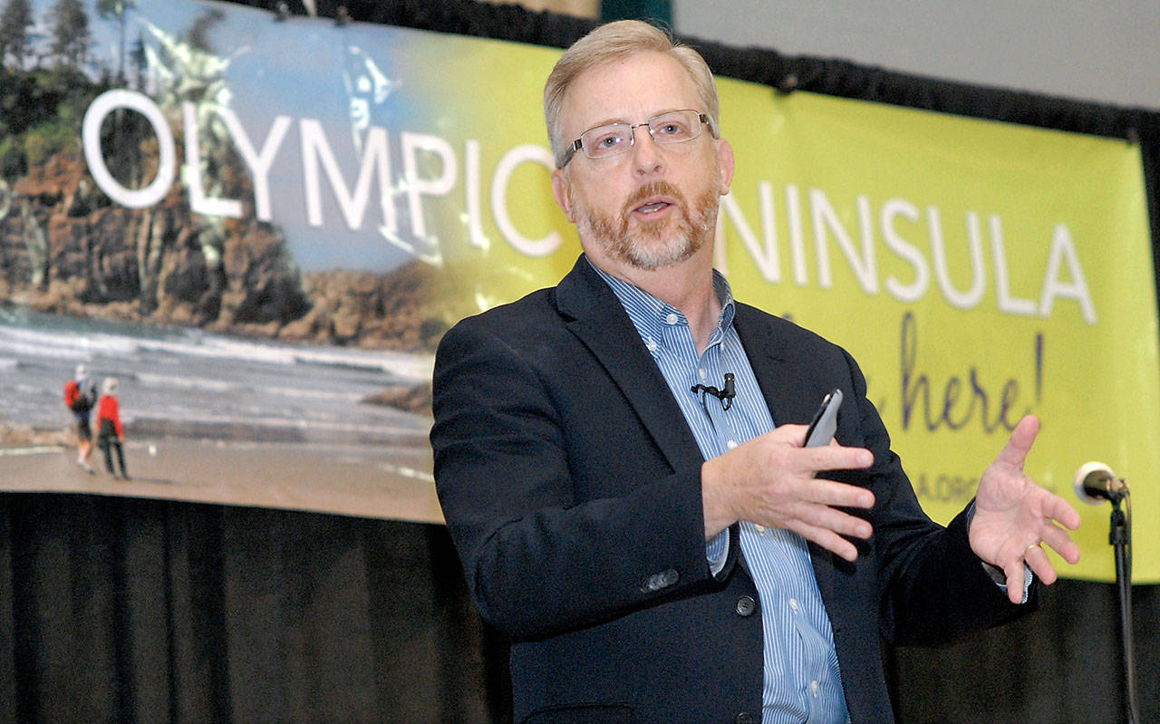 Todd Davidson, chief executive officer for Travel Oregon, delivers the keynote speech during Thursday’s 2017 Olympic Peninsula Tourism Summit at the Vern Burton Community Center in Port Angeles. (Keith Thorpe/Peninsula Daily News)