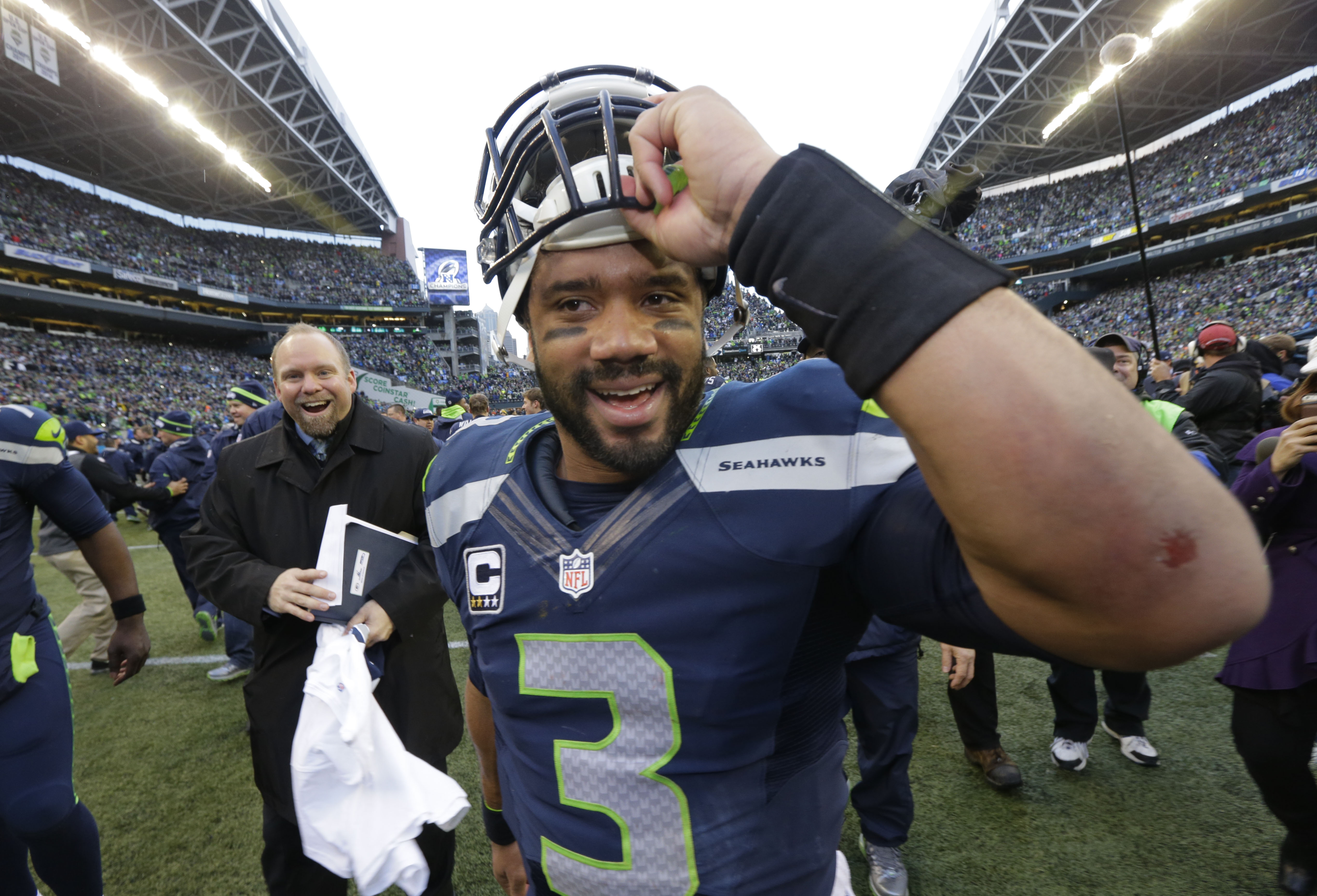 Seahawks quarterback Russell Wilson celebrates after the victory over the Green Bay Packers (The Associated Press (Click on photo to enlarge))