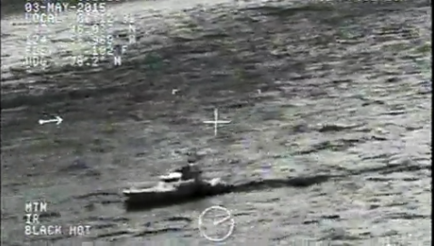 A video camera aboard an MH-65 Dolphin helicopter from the Port Angeles Coast Guard Air Station shows the motor life boat from Station Quillayute River searching at daybreak Sunday morning. (U.S. Coast Guard)