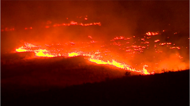 Flames race across a ridge near Twisp. The Associated Press