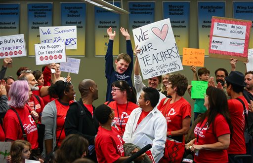 Seattle Education Association negotiators and supporters announce Tuesday evening that they plan to start the school year on strike. Joshua Trujillo/seattlepi.com via AP