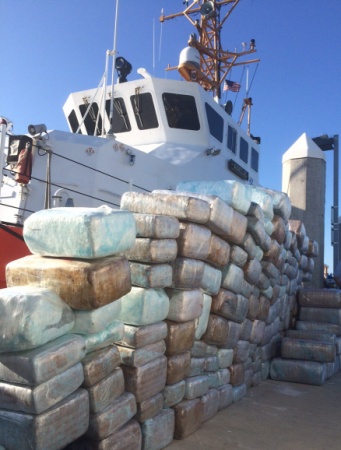 Bales of interdicted marijuana are stacked on the pier in San Diego in front of the Coast Guard cutter Adelie. The Adelie is based in Port Angeles. U.S. Coast Guard