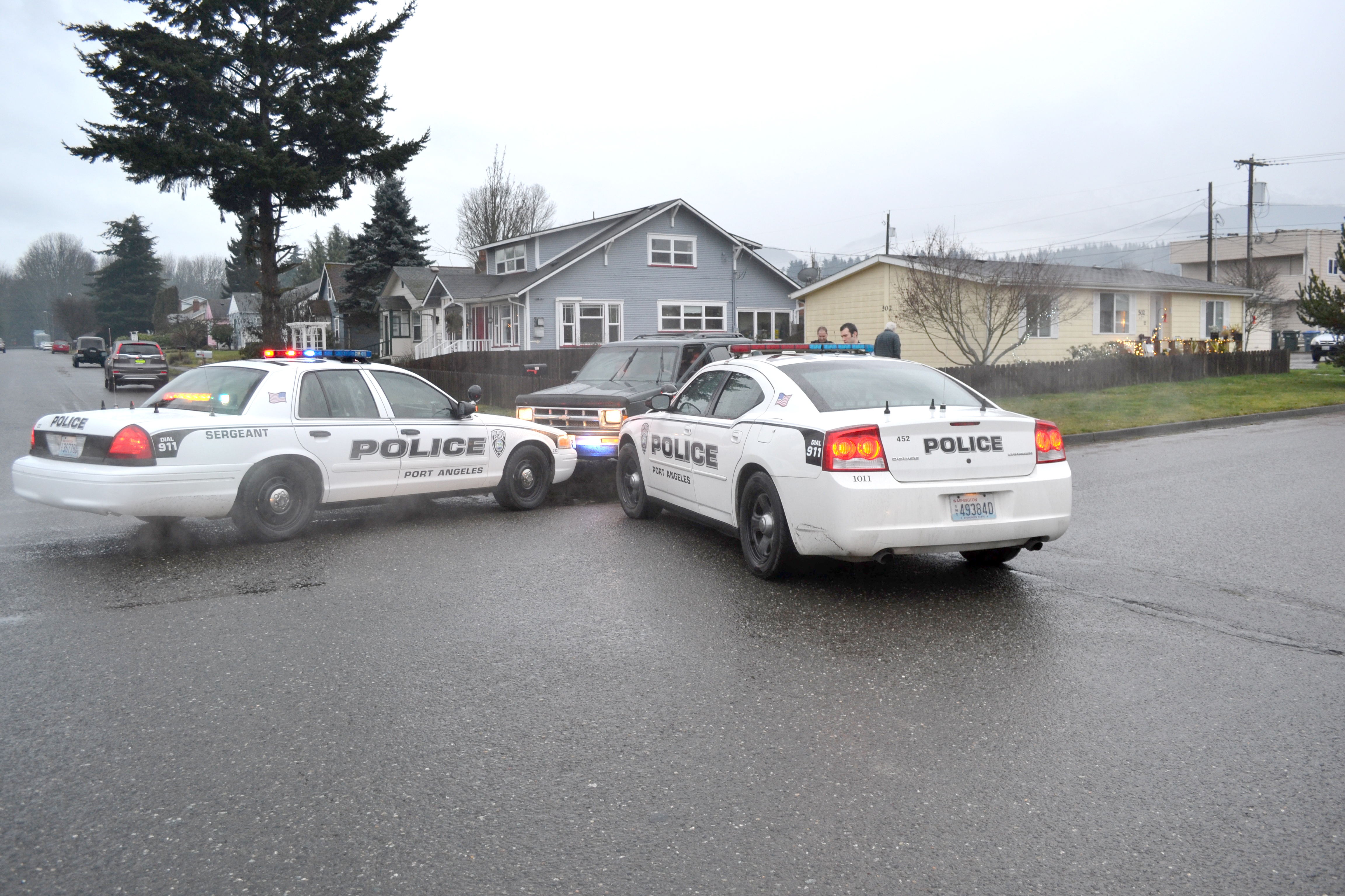 Port Angeles police stop a vehicle at East Seventh Street and Vine Street following a five-block pursuit on Thursday. ()