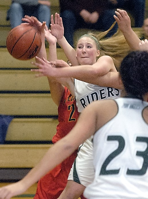 Port Angeles' Kyrsten McGuffey gets tangled up in a sea of Steilacoom Sentinels in the first quarter of Thursday's night's district playoff game at Port Angeles High School. (Keith Thorpe/Peninsula Daily News)