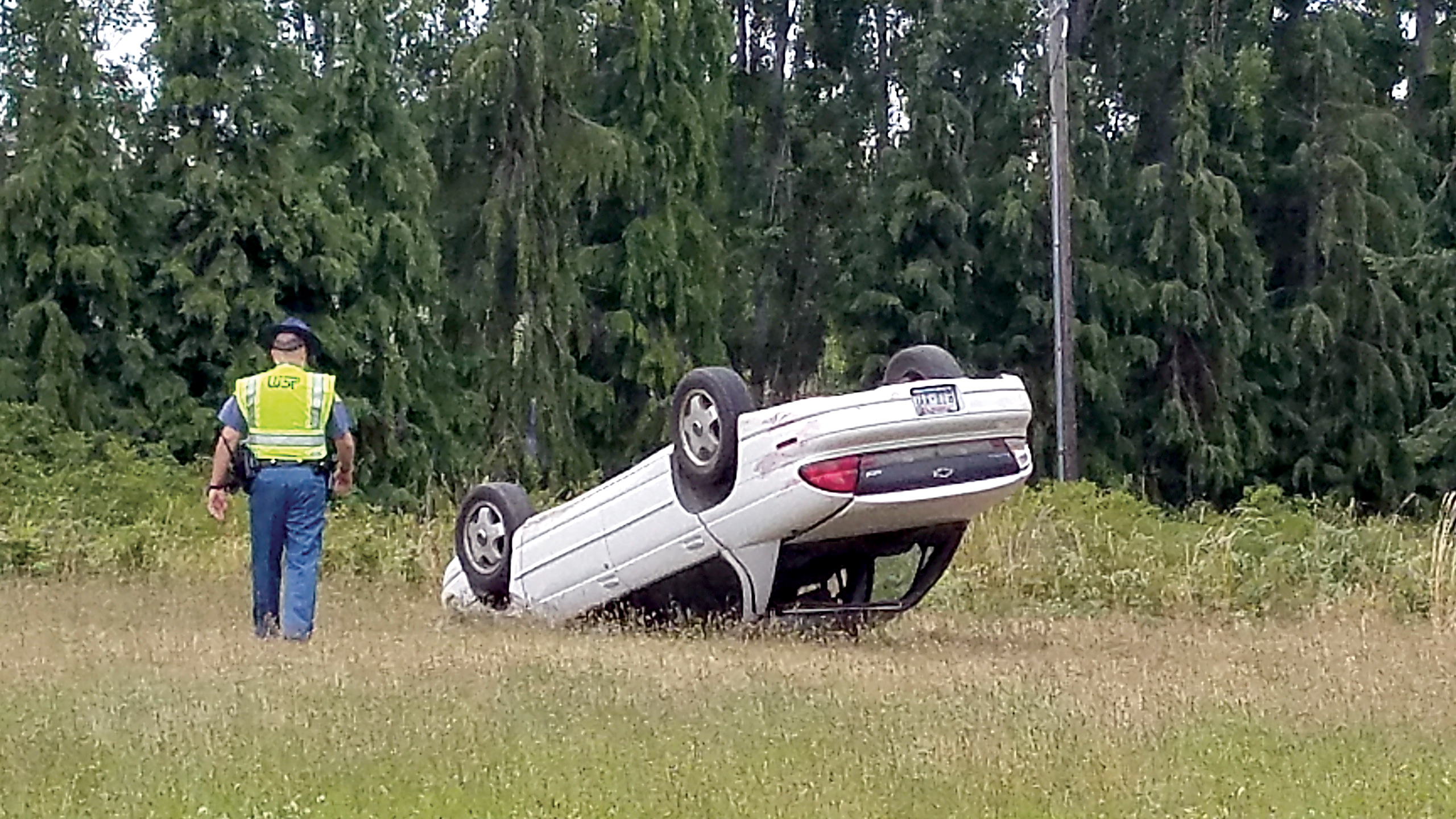 This vehicle left the road near Sequim in a rollover wreck Tuesday evening. (Ed Evans/KSQM Radio)