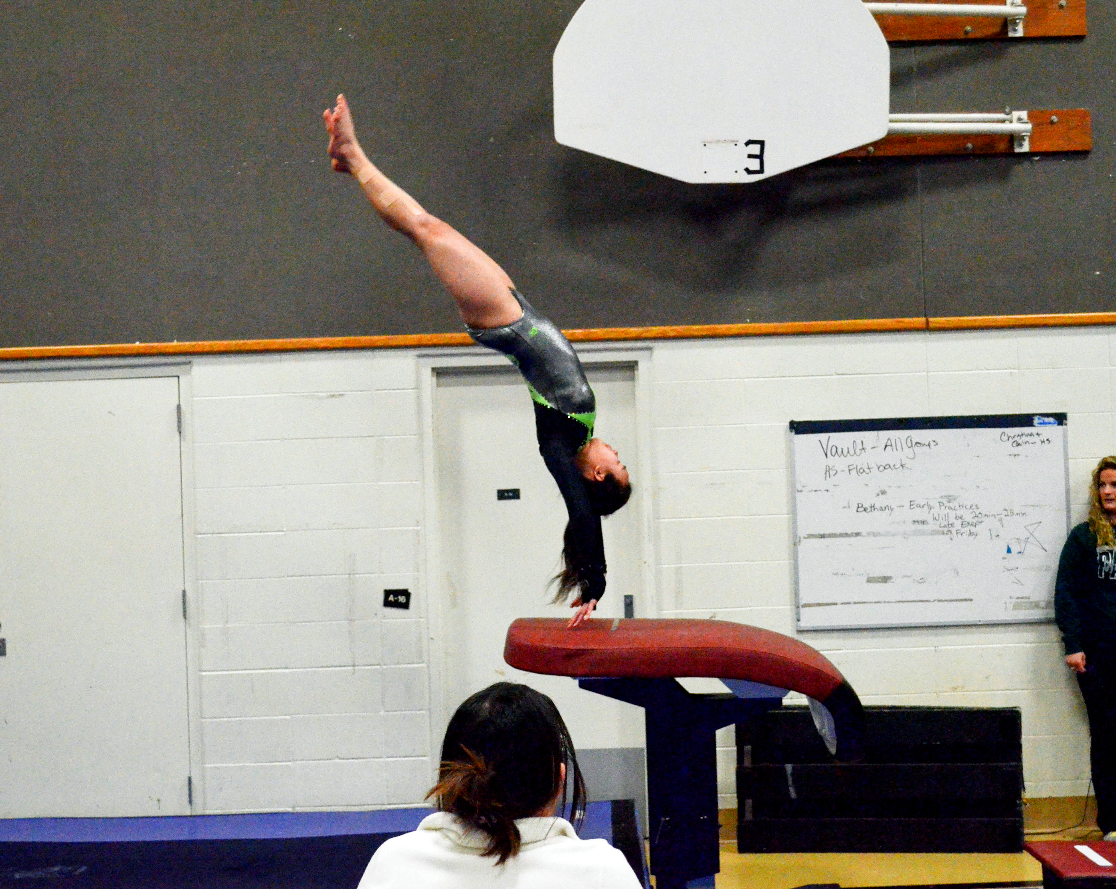 Port Angeles sophomore Lum Fu gets air during the vault. ()