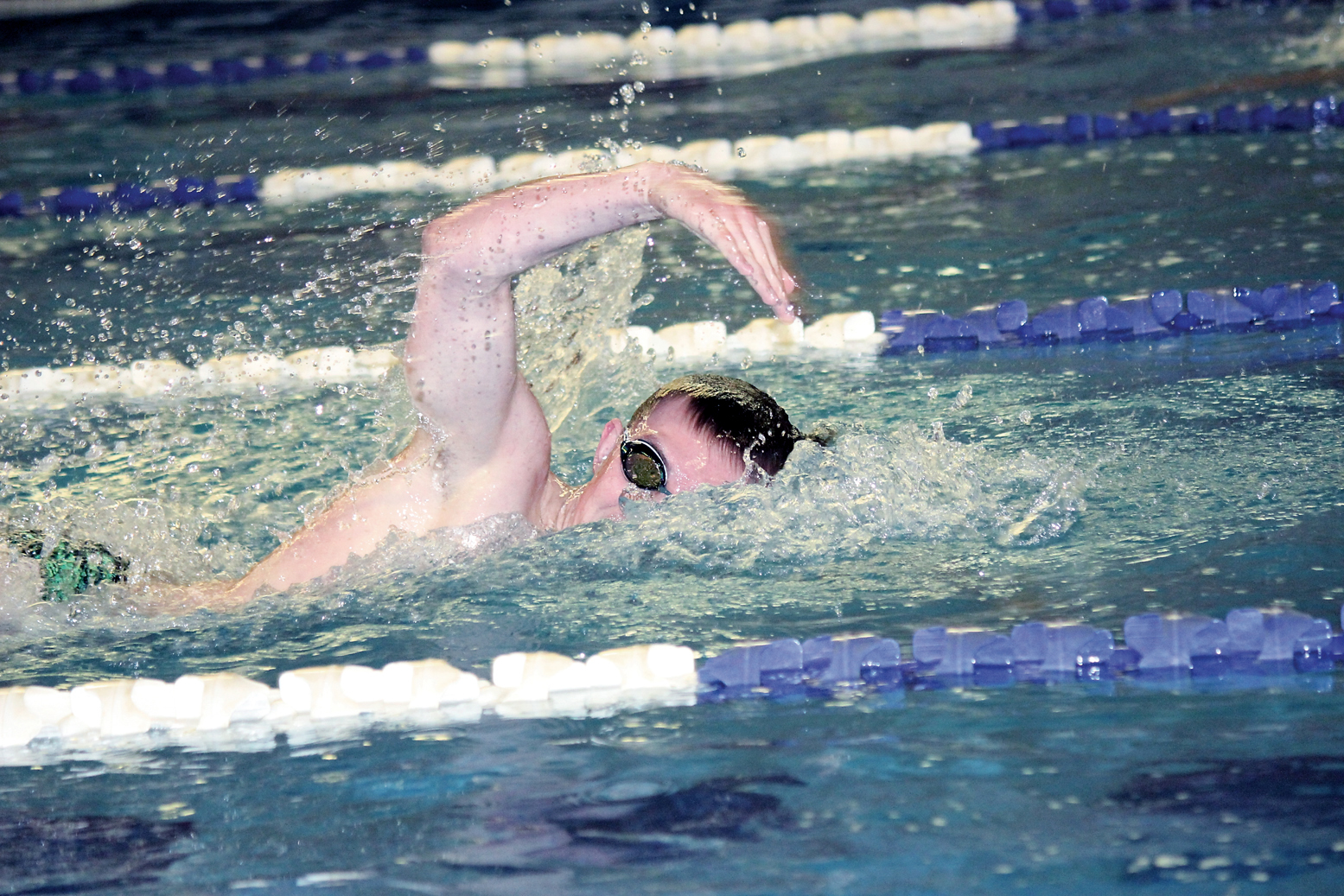 Port Angeles' Tristin Butler swims a state-qualifying time in the 200-yard freestyle during the Roughriders win against Bremerton. (Patty Reifenstahl)