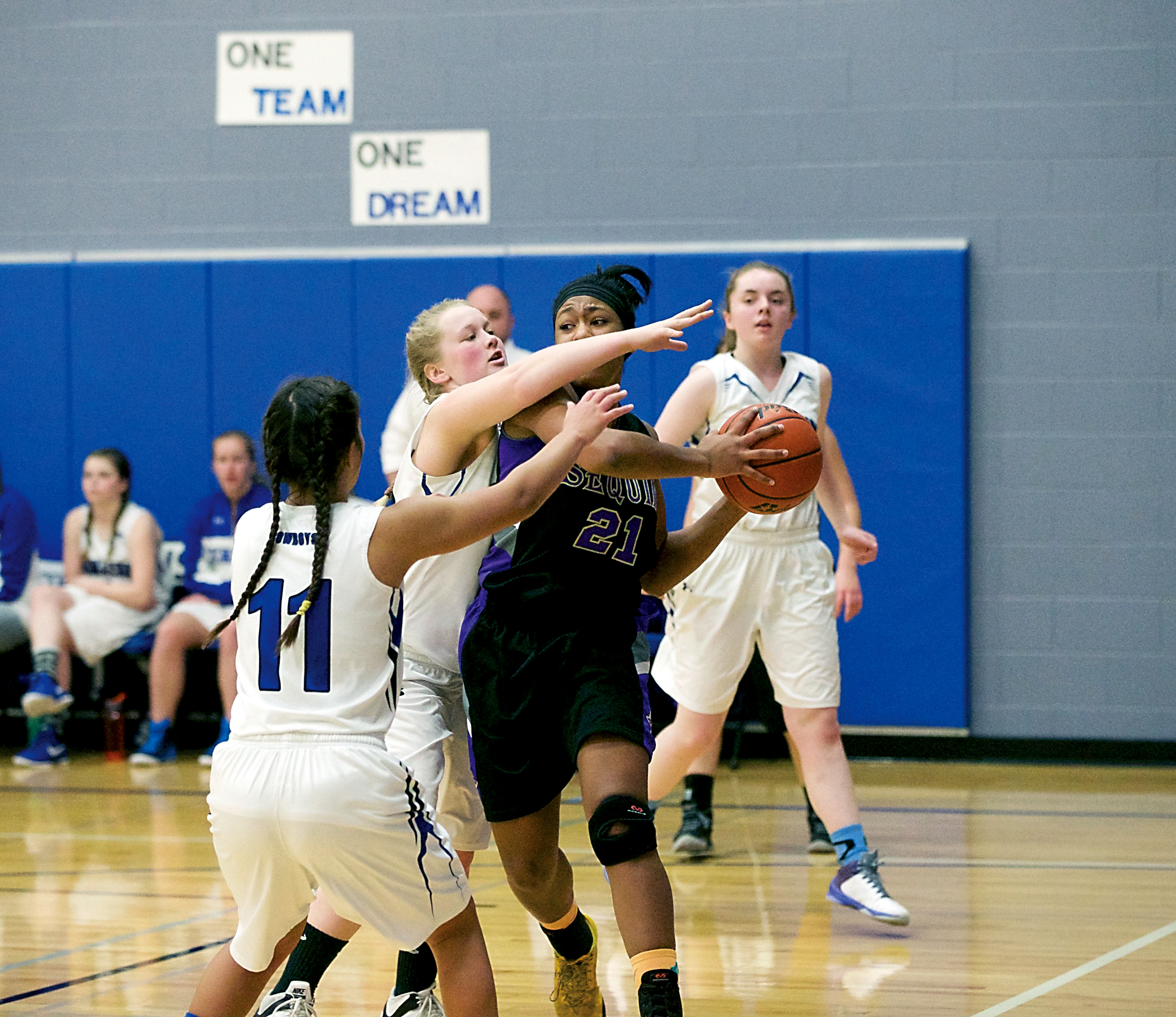 Sequim's Adrienne Haggerty (21) is swarmed by Chimacum defenders