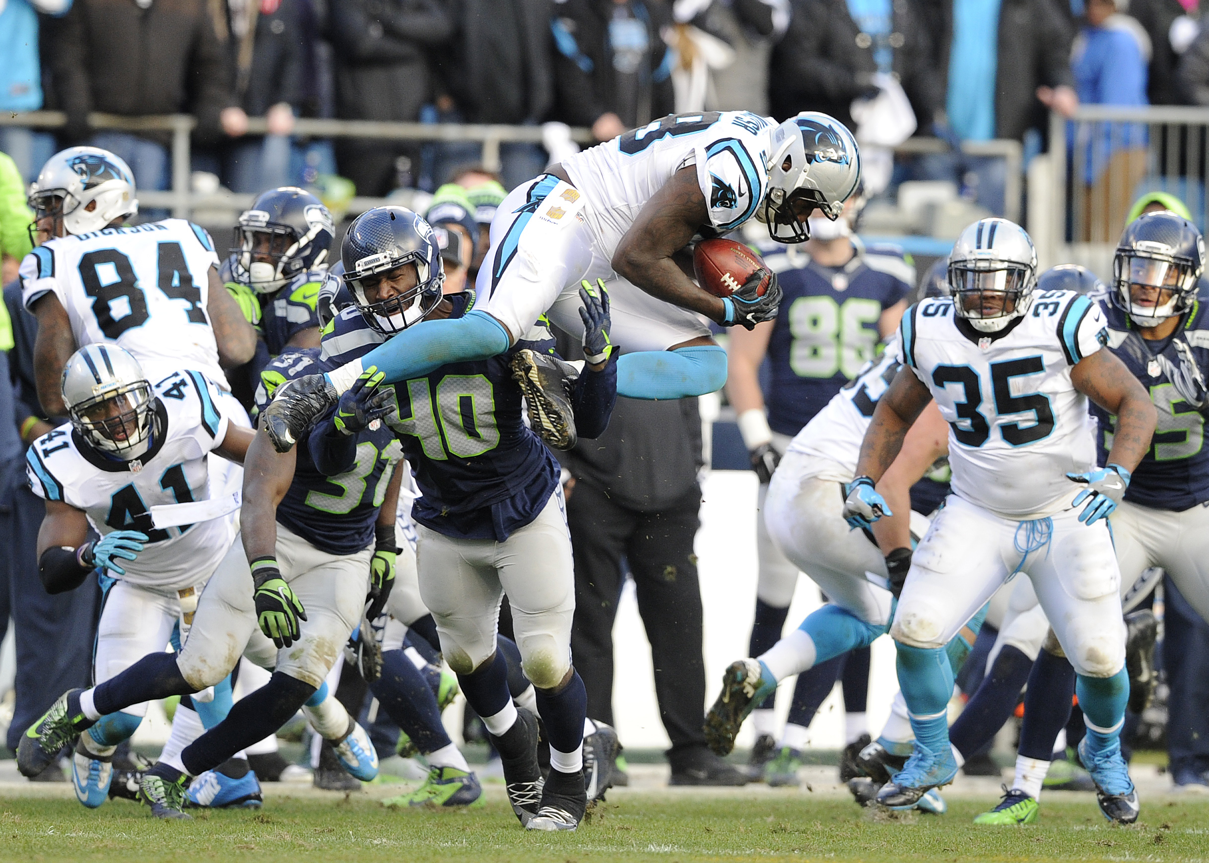 Carolina Panthers outside linebacker Thomas Davis (58) receives an on-side kick from the Seattle Seahawks during the second half of an NFL divisional playoff football game