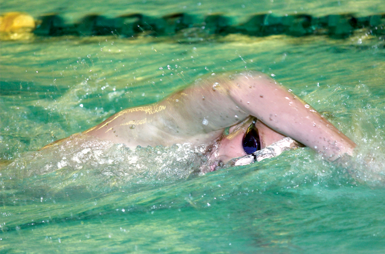 Cameron Butler of Port Angeles swims a state-qualifying time in the 500-yard freestyle against Kingston. (Patty Reifenstahl)