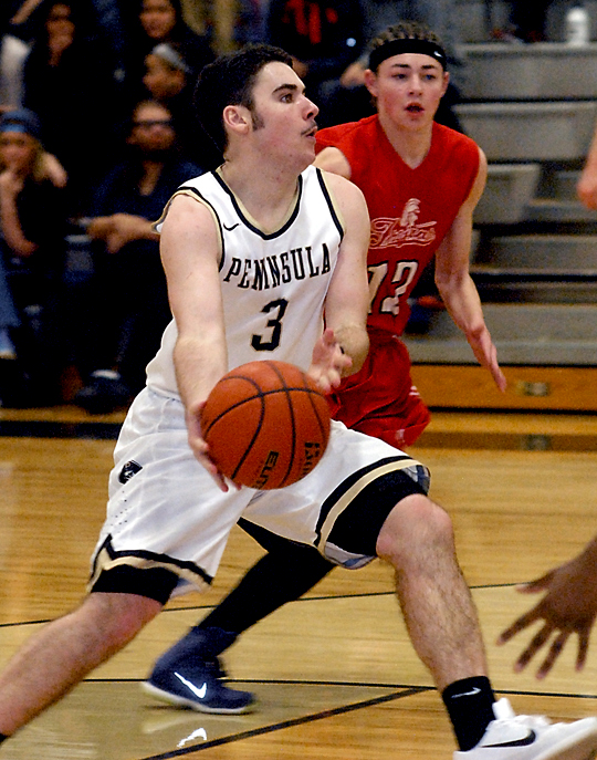 Peninsula's Ryley Callaghan drives the lane past Everett's Brevin Brown (12) in the first half of the Pirates' NWAC North victory over the Trojans. (Keith Thorpe/Peninsula Daily News)