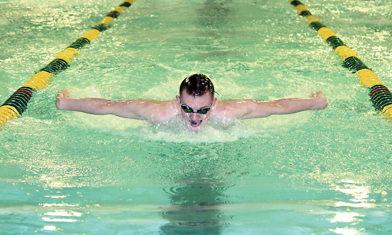 Port Angeles' Tristin Butler earns a state-qualifying time in the 100-yard butterfly during the Roughriders' dual-meet victory against Olympic and Klahowya on Thursday. (Patty Reifenstahl)