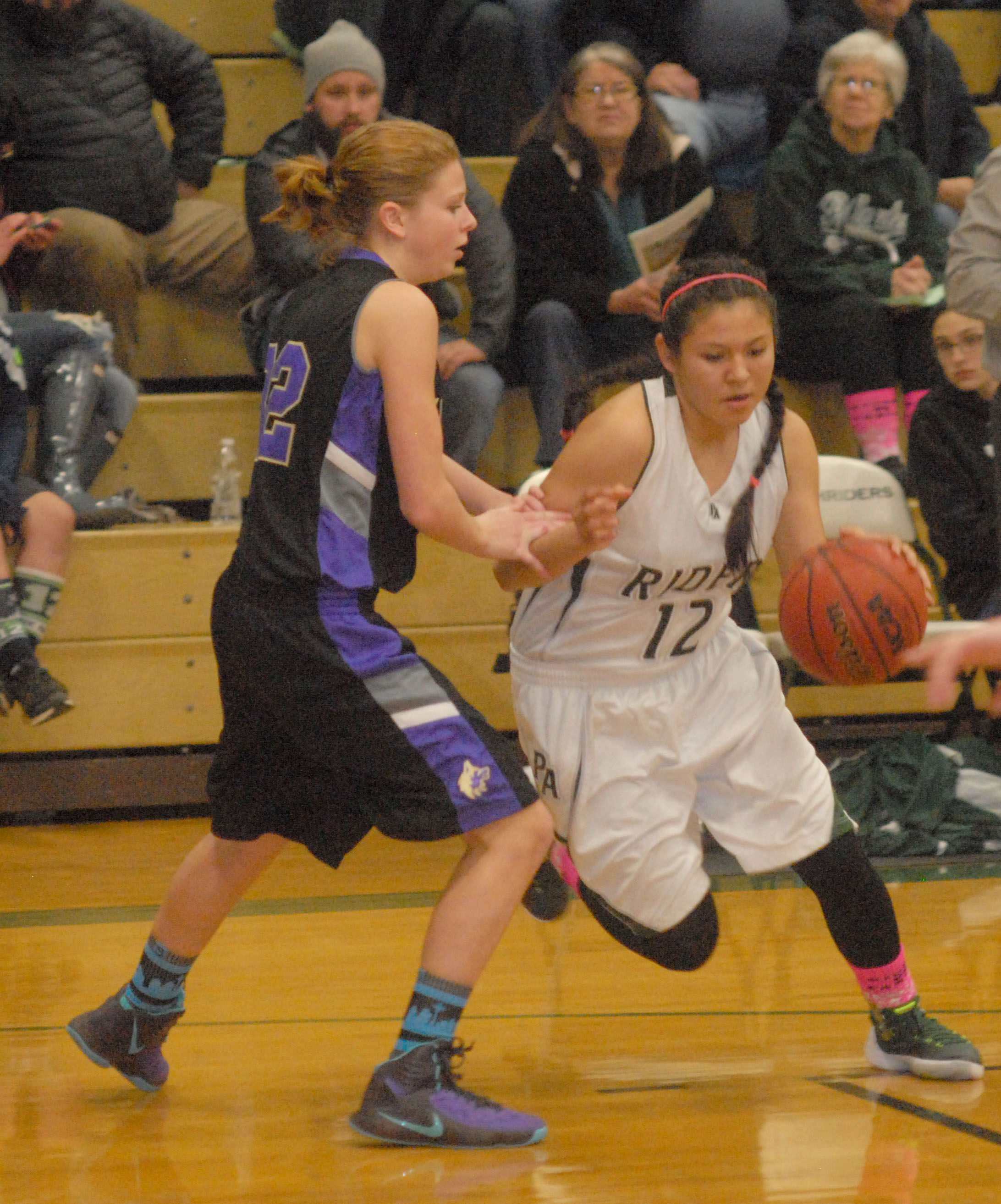 Port Angeles' Cheyenne Wheeler drives against Sequim's Alisha Grasser earlier this season. The Roughriders have a chance to win the Olympic League 2A title. (Keith Thorpe/Peninsula Daily News)