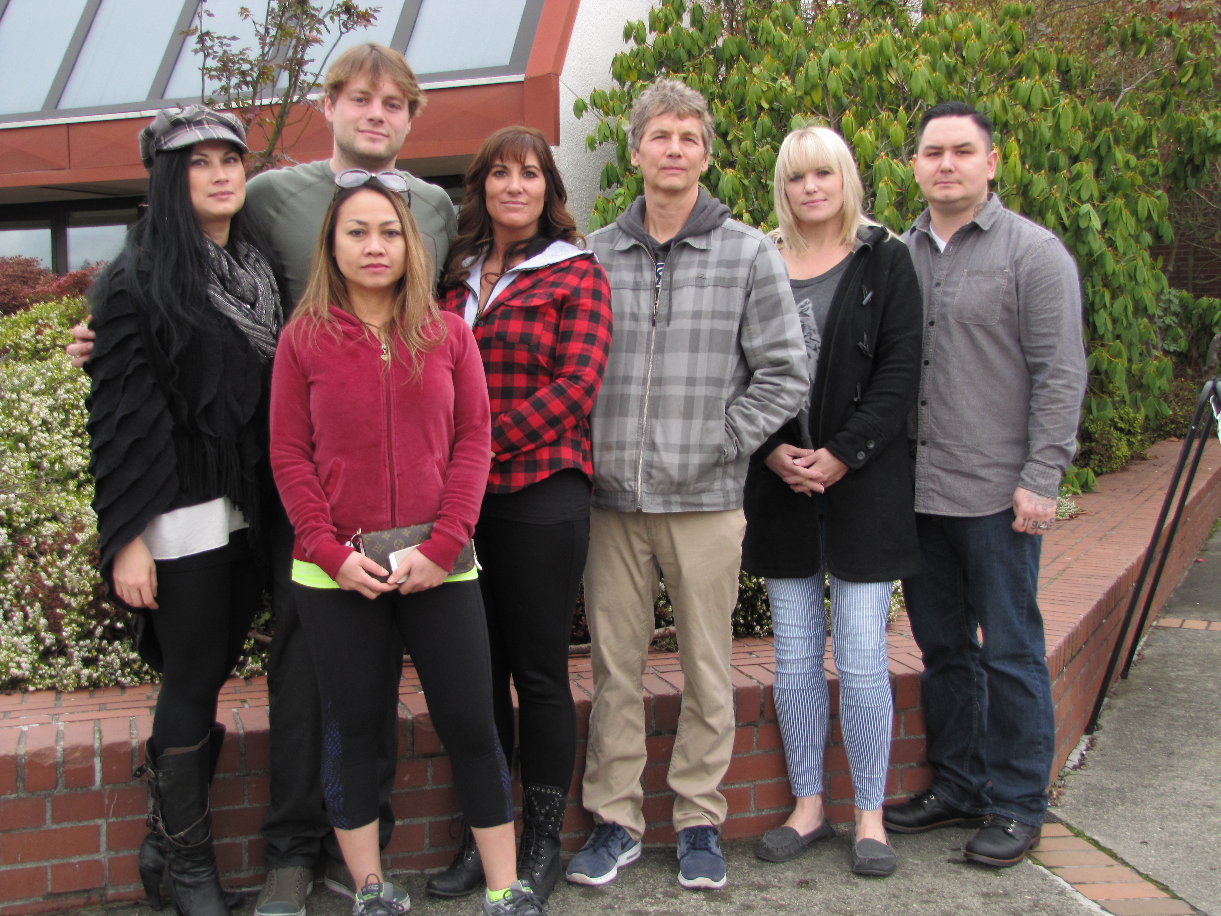 A group of Port Angeles business owners gathers at the Clallam County Courthouse on Monday to express their solidarity and concern about ongoing burglary problems in the area. They are