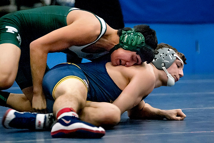 Port Angeles' Thomas Blevins takes on Reubin Hendricks of Burlington-Edison in the 170-pound class of the 2A Region 1 tournament. Blevins lost the first-round match to Hendricks and then was eliminated by teammate Blake Mann. (Chris Tucker/Central Kitsap Reporter)