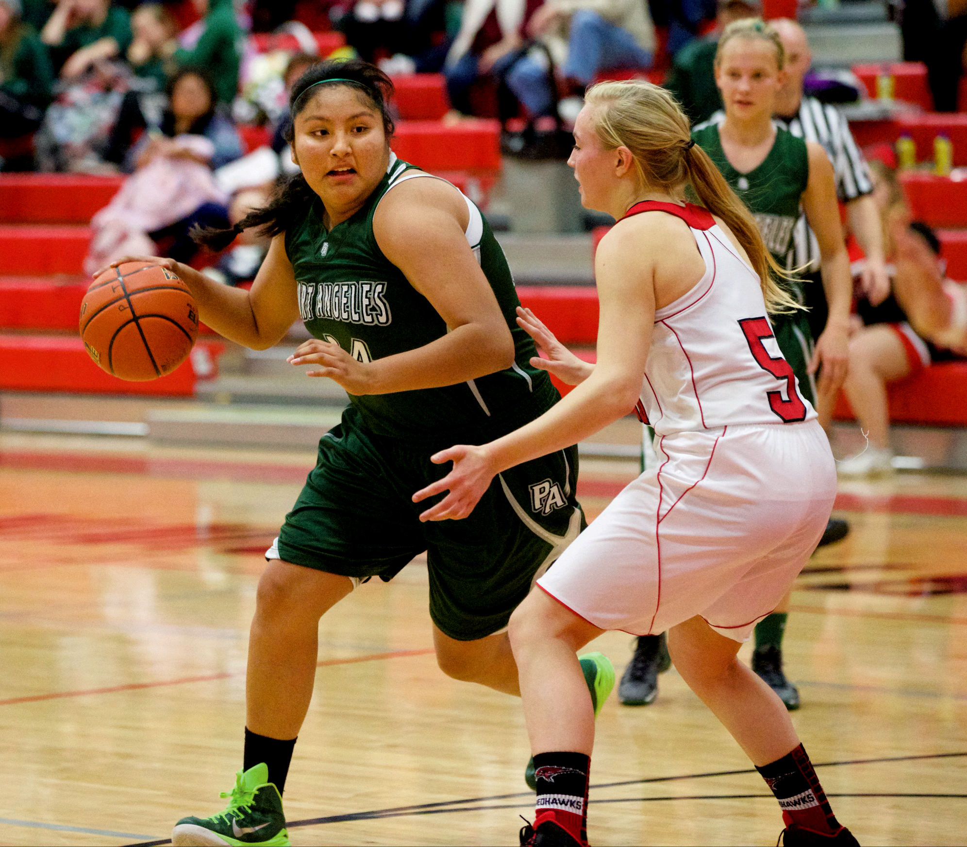 Port Angeles' Nizhoni Wheeler looks for a way around Port Townsend's Kaitlyn Meek during a game in Port Townsend earlier this season. Wheeler and the 10th-ranked Roughriders play ninth-ranked Anacortes in the 2A regionals today. (Steve Mullensky/for Peninsula Daily News)