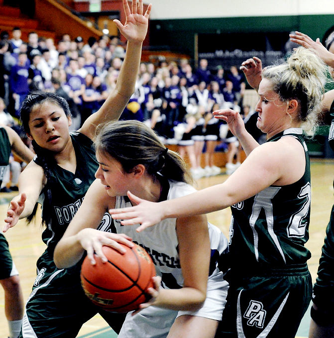 Port Angeles' Cheyenne Wheeler and Hayley Baxley put pressure on Anacortes' Gabby Ronngren during the 2A state regional round at Mount Vernon High School. (Brandy Shreve/Skagit Valley Herald)