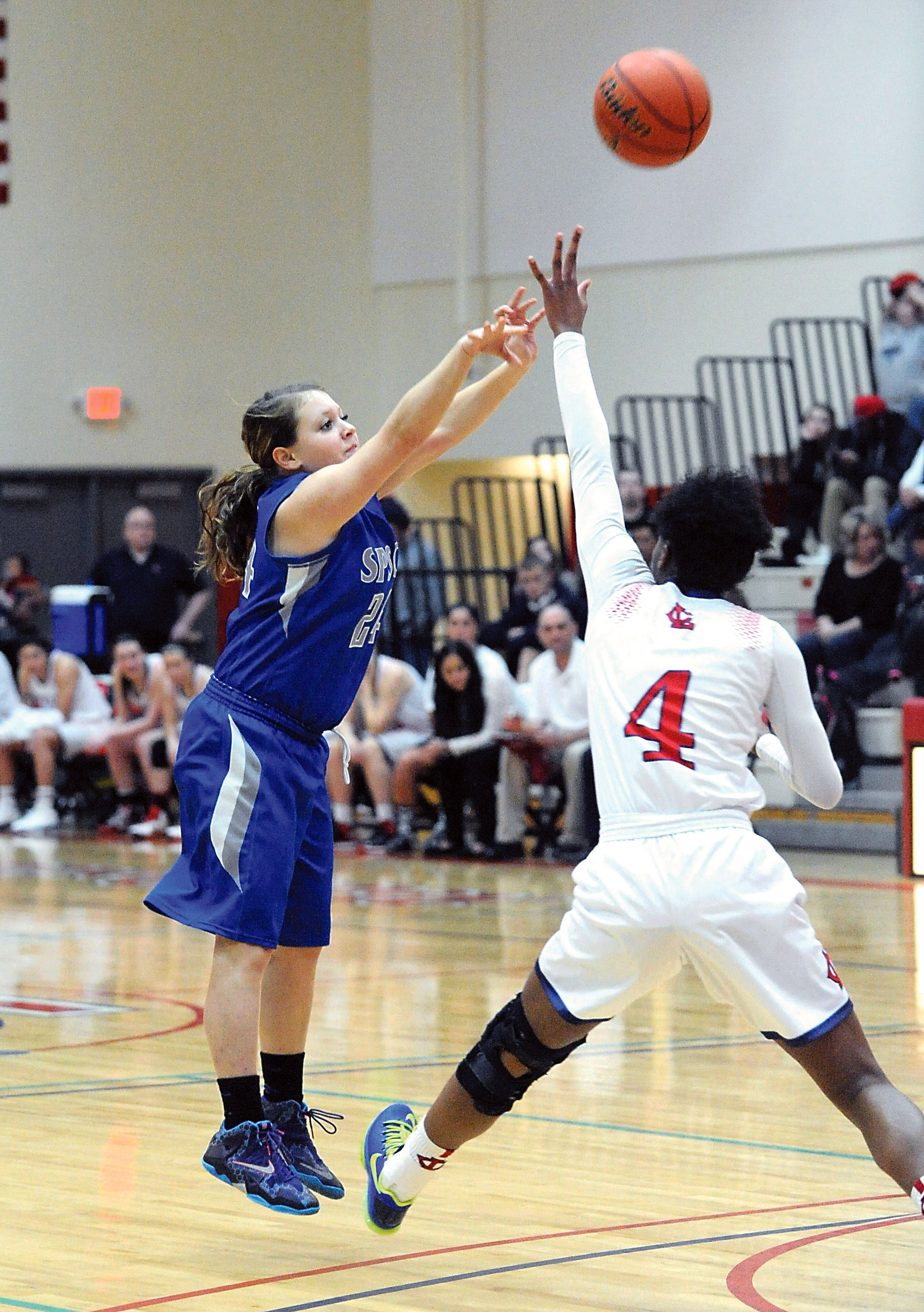 South Puget Sound's Krista Johnson puts up a shot over Lower Columbia's Donniesha Weber in January. Johnson is a 2014 graduate of Port Angeles High School. (Lonnie Archibald/for Peninsula Daily News)