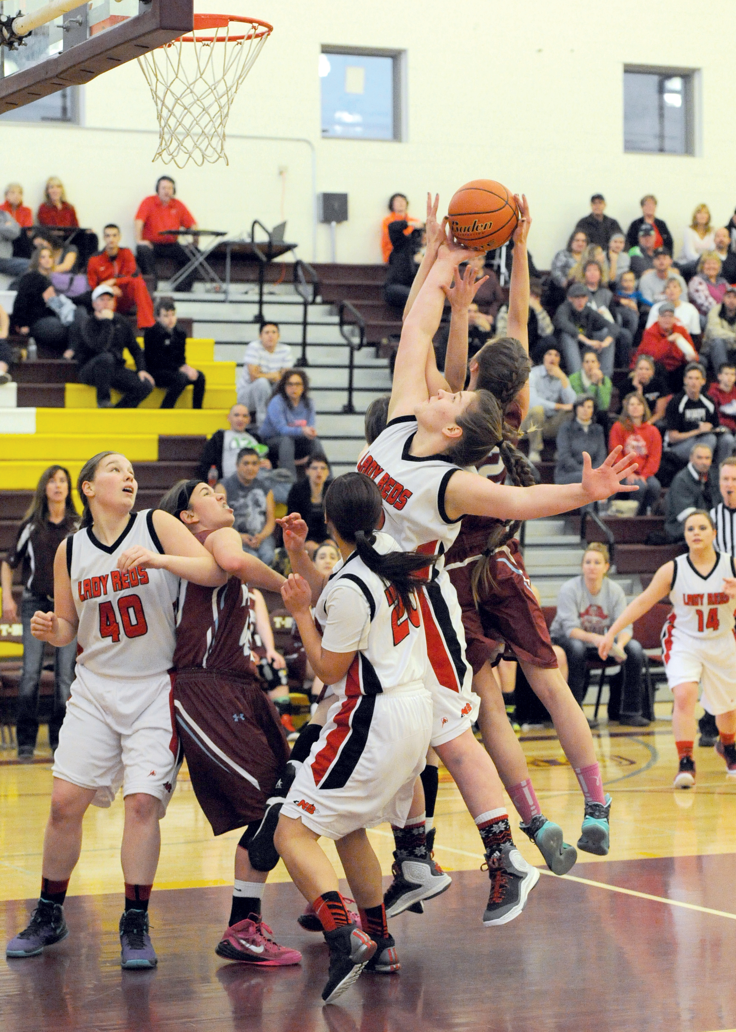 Neah Bay's Faye Charttraw competes for a rebound with a pack of Bickleton players. Also in on the action for Neah Bay are Blaire Hill (40) and Kaela Tyler (20). (Lonnie Archibald/for Peninsula Daily News)