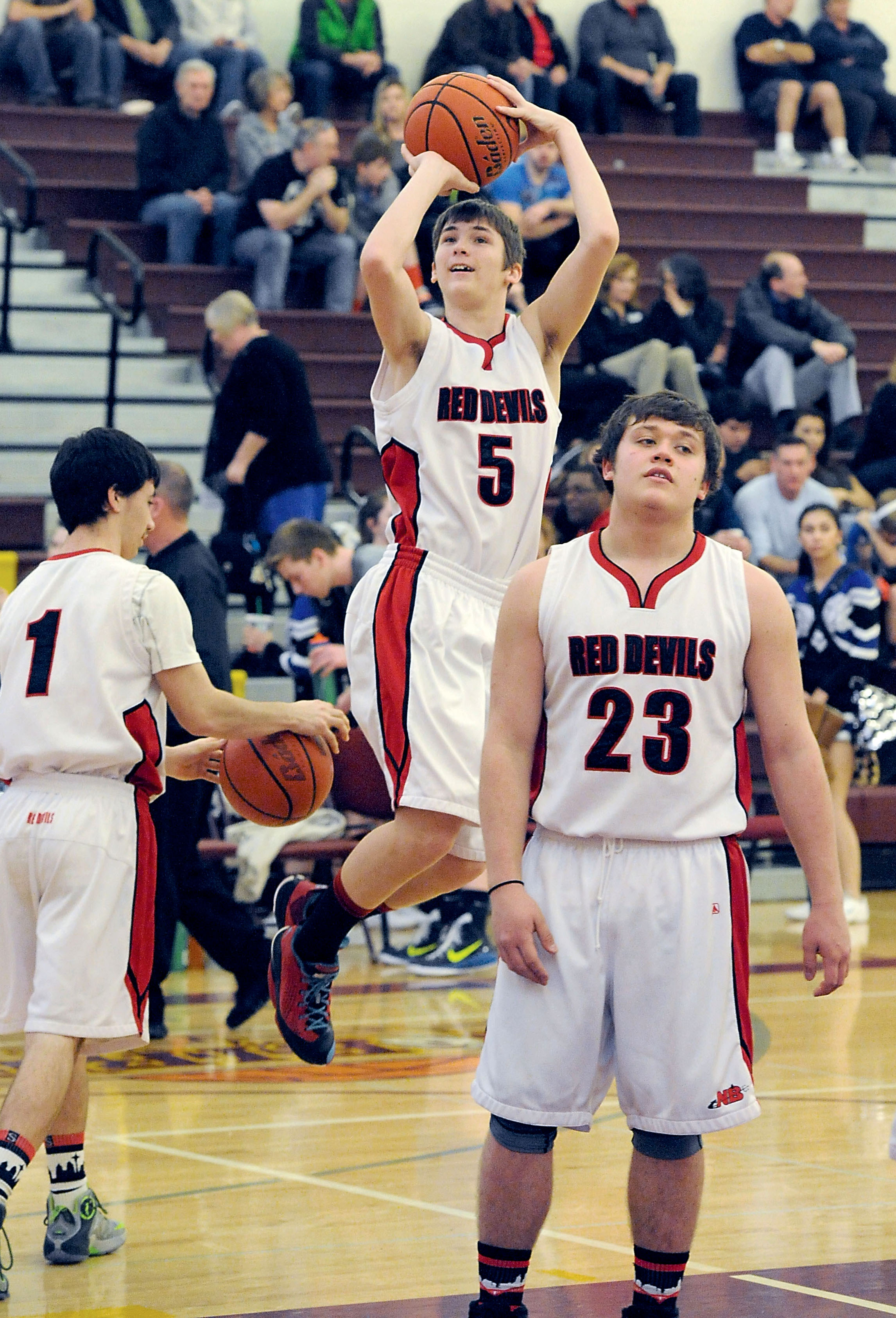 German exchange student Ole Nedderoff (5) warms up during Neah Bay's regional game last week. (Lonnie Archibald/for Peninsula Daily News)