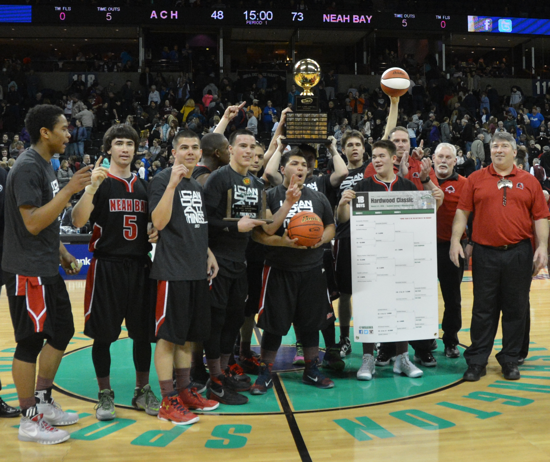 Neah Bay celebrates winning the Class 1B state championship Saturday night at Spokane Arena. (Al Camp/Omak-Okanogan County Chronicle)