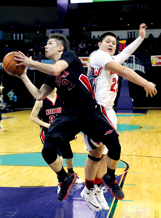 Neah Bay's Jericho McGimpsey ducks under Taholah's Terrance Jones for a score in the first round of the state tournament. McGimpsey is one of three senior starters the Red Devils will have to replace next season. (Roger Harnack/The Daily Sun Times)