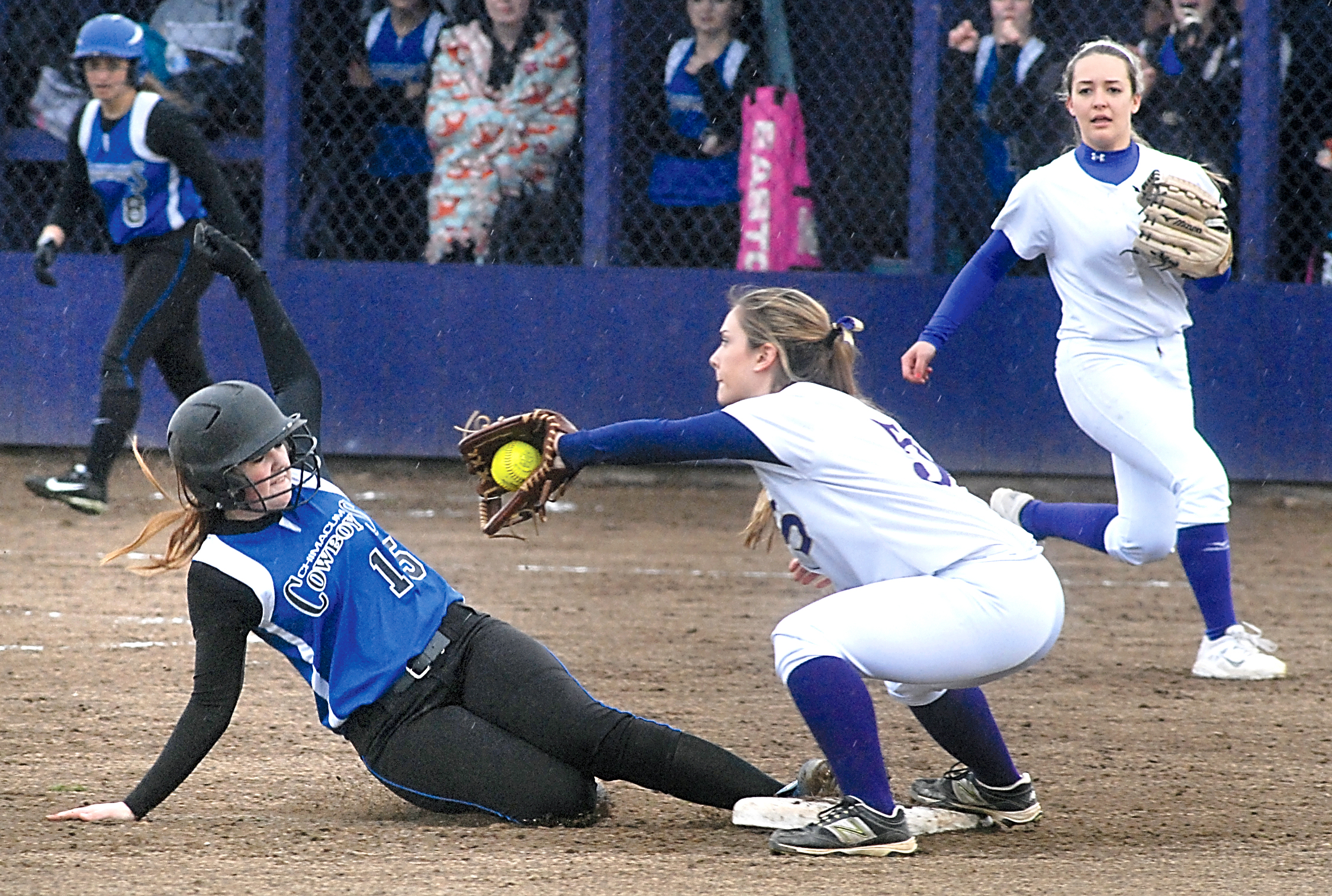 Sequim's Mary Lu Clift makes the catch at second base to beat a sliding Lauren Montgomery of Chimacum. Backing up Clift is Sequim's McKenzie Bentz