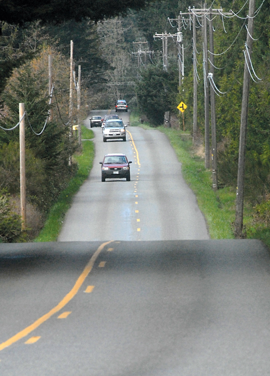 Traffic flows along Lower Elwha Road on the east edge of Port Angeles. Clallam County plans to widen the road between Edgewood Drive and Kacee Way in 2016. (Keith Thorpe/Peninsula Daily News)