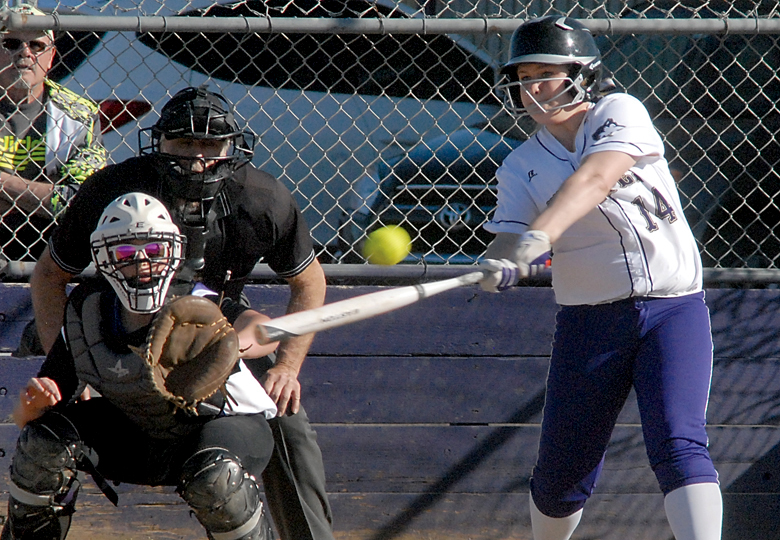 Sequim's Shelby Jones connects as North Kitsap catcher Lamara Villiard waits for the delivery. The Wolves blanked the Vikings 10-0. (Keith Thorpe/Peninsula Daily News)