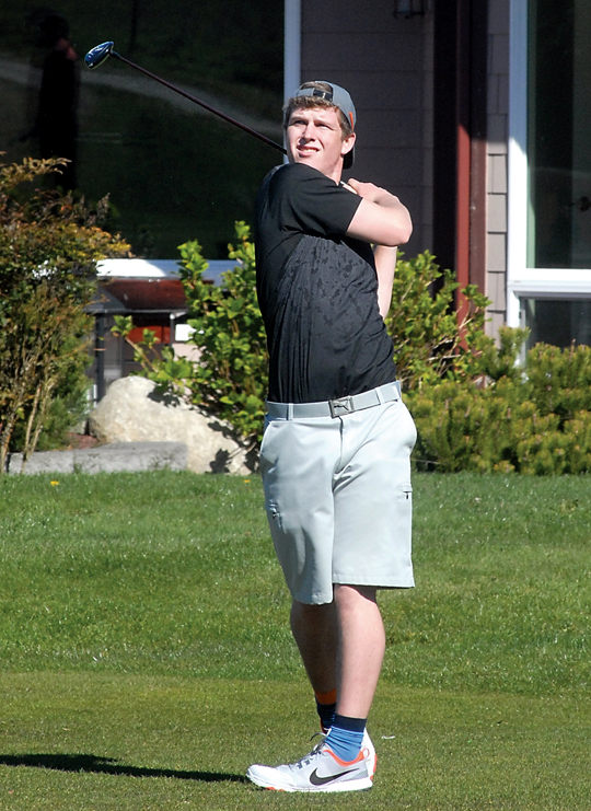 Sequim's Jack Shea tees off on the third hole at Cedars at Dungeness. Shea finished at 2-under-par 70 to lead the Wolves to a victory over Port Townsend. (Keith Thorpe/Peninsula Daily News)